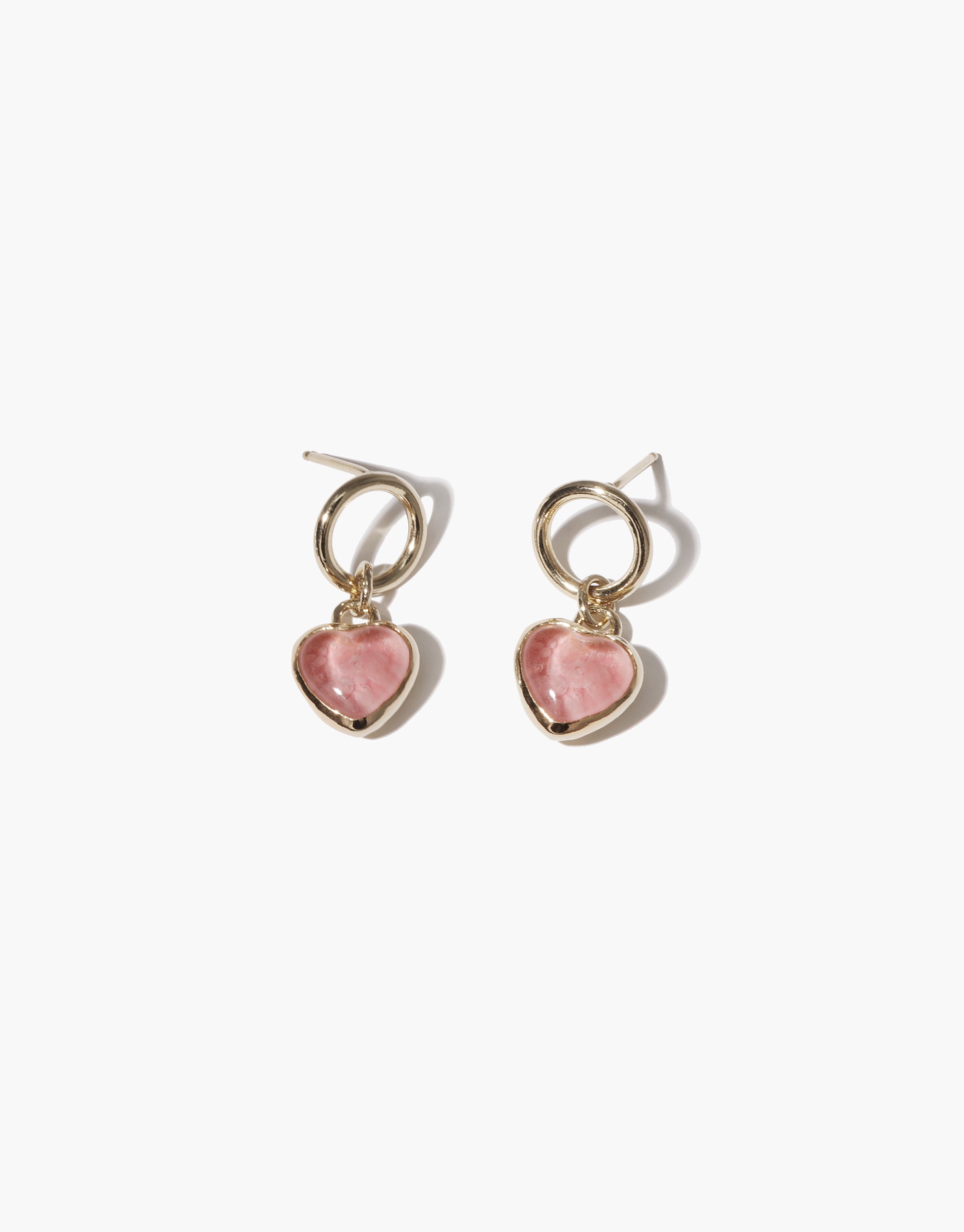 Elegant Heart Dangling Earrings featuring gold-toned hoops with pink heart-shaped charms. Delicate and feminine design, perfect for everyday wear or special occasions. Handcrafted with upcycled glass for eco-conscious style. Heart Dangling Earrings by CLED.