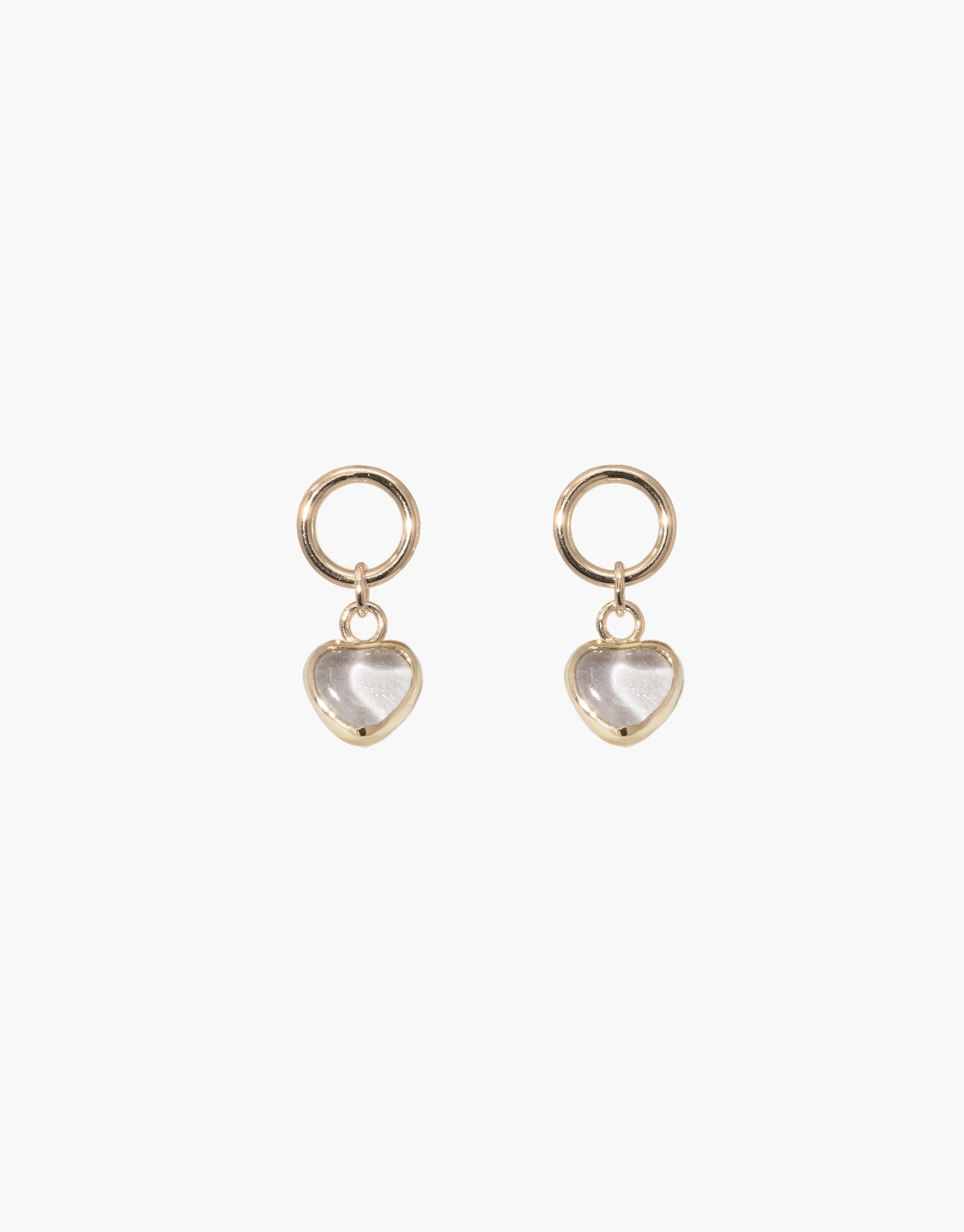 Elegant Heart Dangling Earrings featuring gold-toned hoops with translucent heart-shaped charms. Handcrafted jewelry showcasing upcycled eco gems repurposed from discarded glass bottles. Delicate and sustainable accessory perfect for everyday wear. Heart Dangling Earrings by CLED.