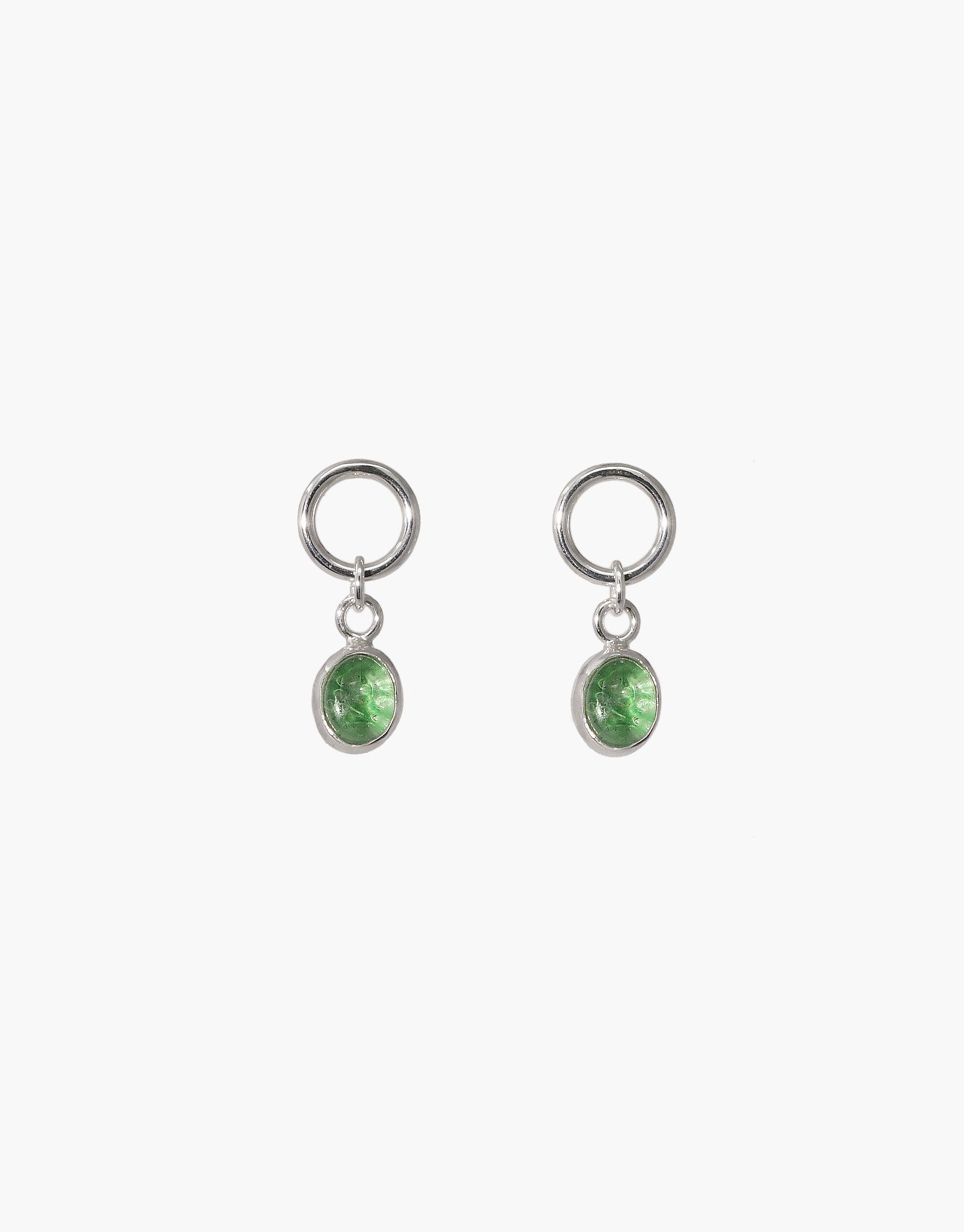 Elegant Oval Dangling Earrings featuring silver hoops with green oval charms. Handcrafted design showcasing upcycled eco gems from repurposed glass bottles. Sustainable and stylish jewelry piece perfect for eco-conscious fashion lovers. Oval Dangling Earrings by CLED.