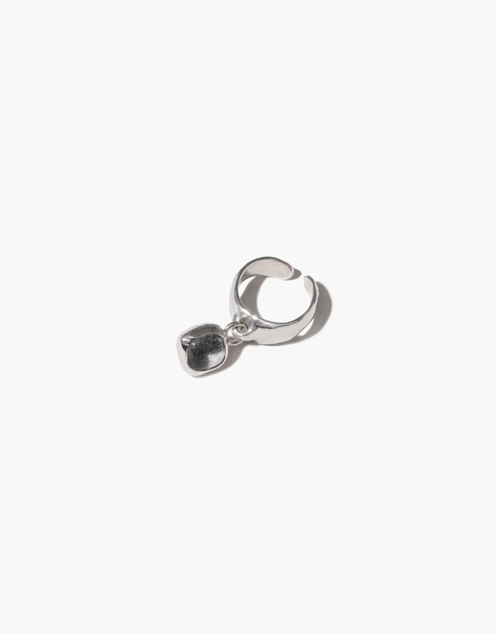 Square Dangling Ear Cuff featuring a silver ring with a black stone charm, handmade using upcycled Eco Gem from discarded glass bottles, reflecting CLED's eco-conscious craftsmanship.