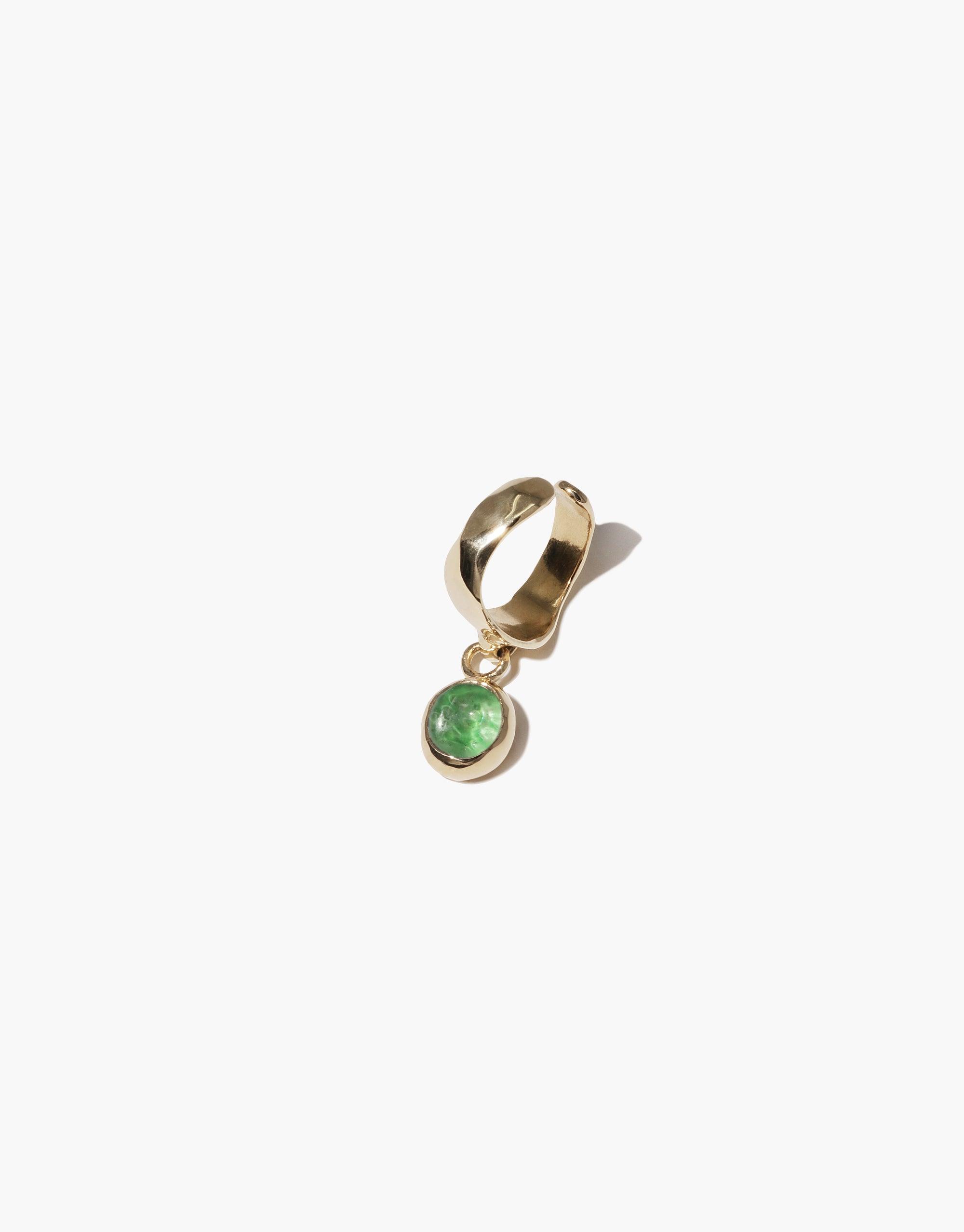 Oval Dangling Ear Cuff with gold-toned metal and green eco-friendly charm, featuring a unique curved design and sustainable upcycled glass dangle. Handcrafted jewelry piece showcasing elegance and environmental consciousness. CLED