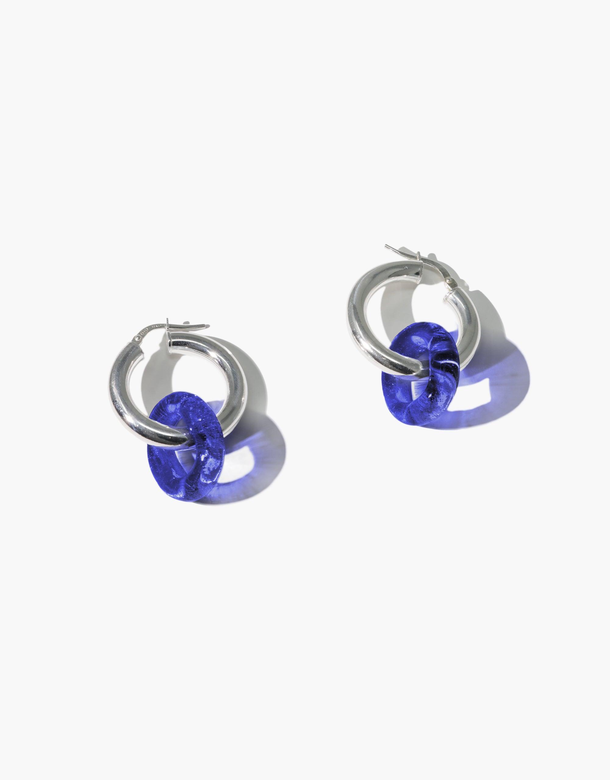 Silver hoop earrings with vibrant blue eco gems repurposed from glass bottles, showcasing sustainable elegance. In The Loop Hoops | Large by CLED