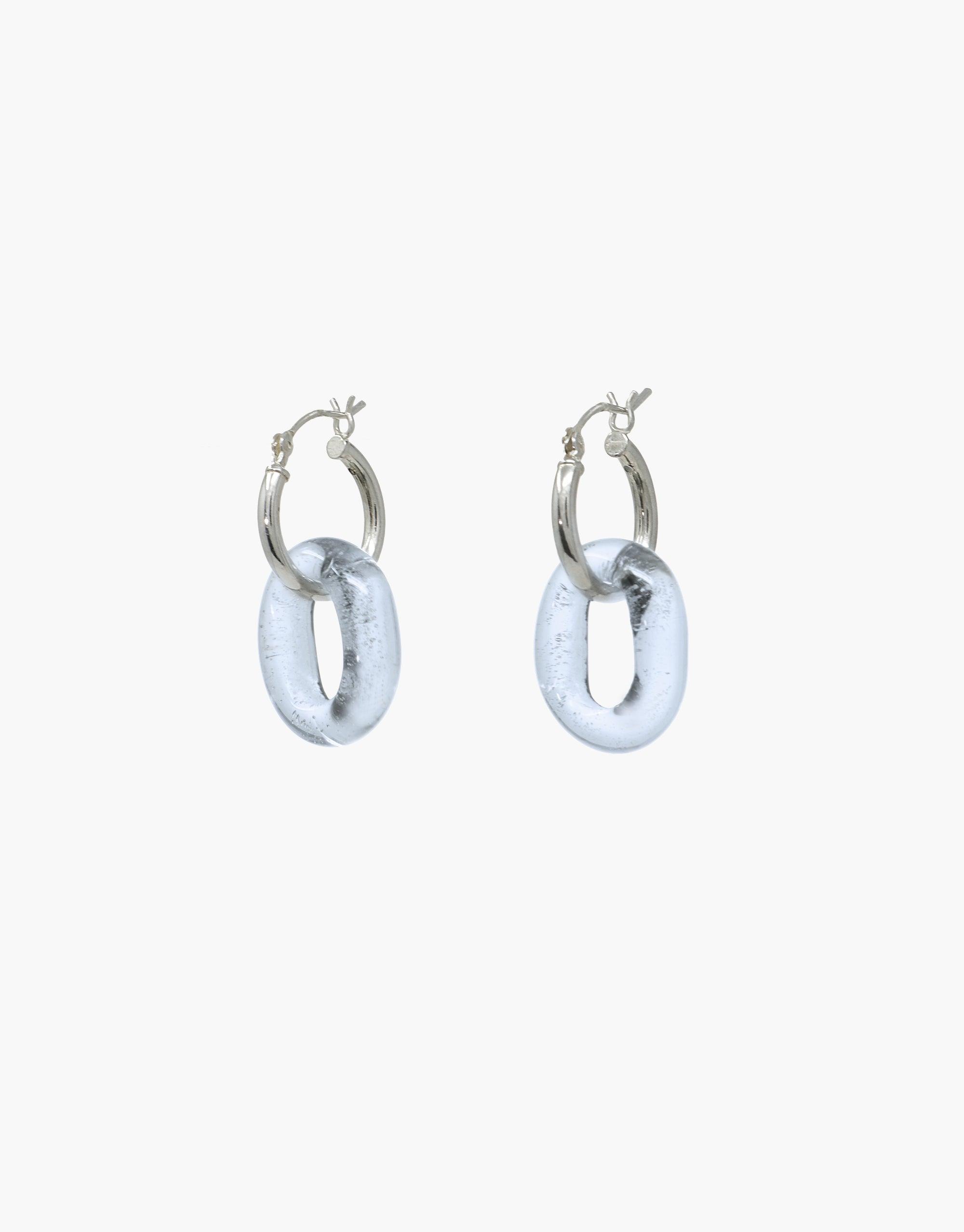 Silver hoop earrings with small translucent blue eco gem loops, showcasing sustainable elegance. Handcrafted from repurposed glass bottles, these In The Loop Hoops | Small offer minimal yet stylish design for eco-conscious fashion lovers. CLED