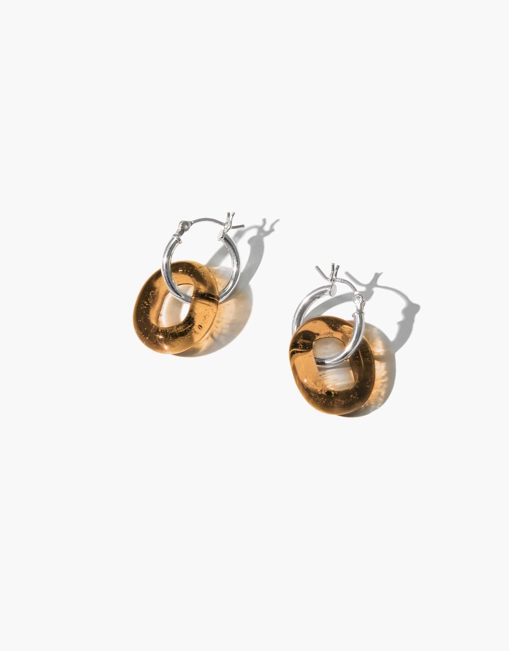 Small hoop earrings with amber-colored eco gem loops, handcrafted from recycled glass bottles. Sterling silver or gold vermeil options available. Sustainable and stylish jewelry for everyday wear. In The Loop Hoops | Small by CLED