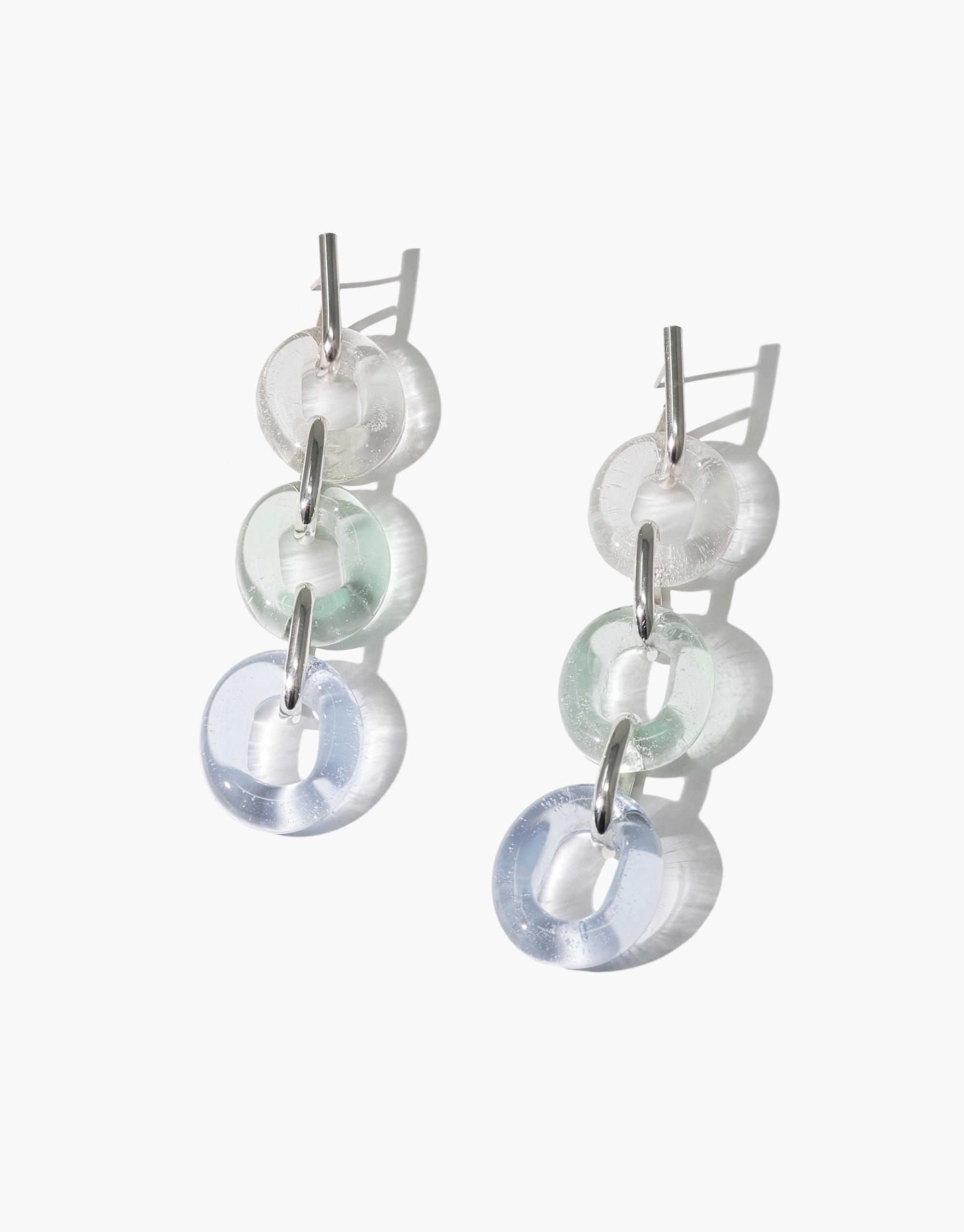 ITL Trio Earrings | Sky featuring three linked glass loops in white, mint, and blue shades. Handcrafted eco-friendly earrings made from repurposed glass bottles. Sterling silver hooks. Stylish and sustainable jewelry piece by CLED.