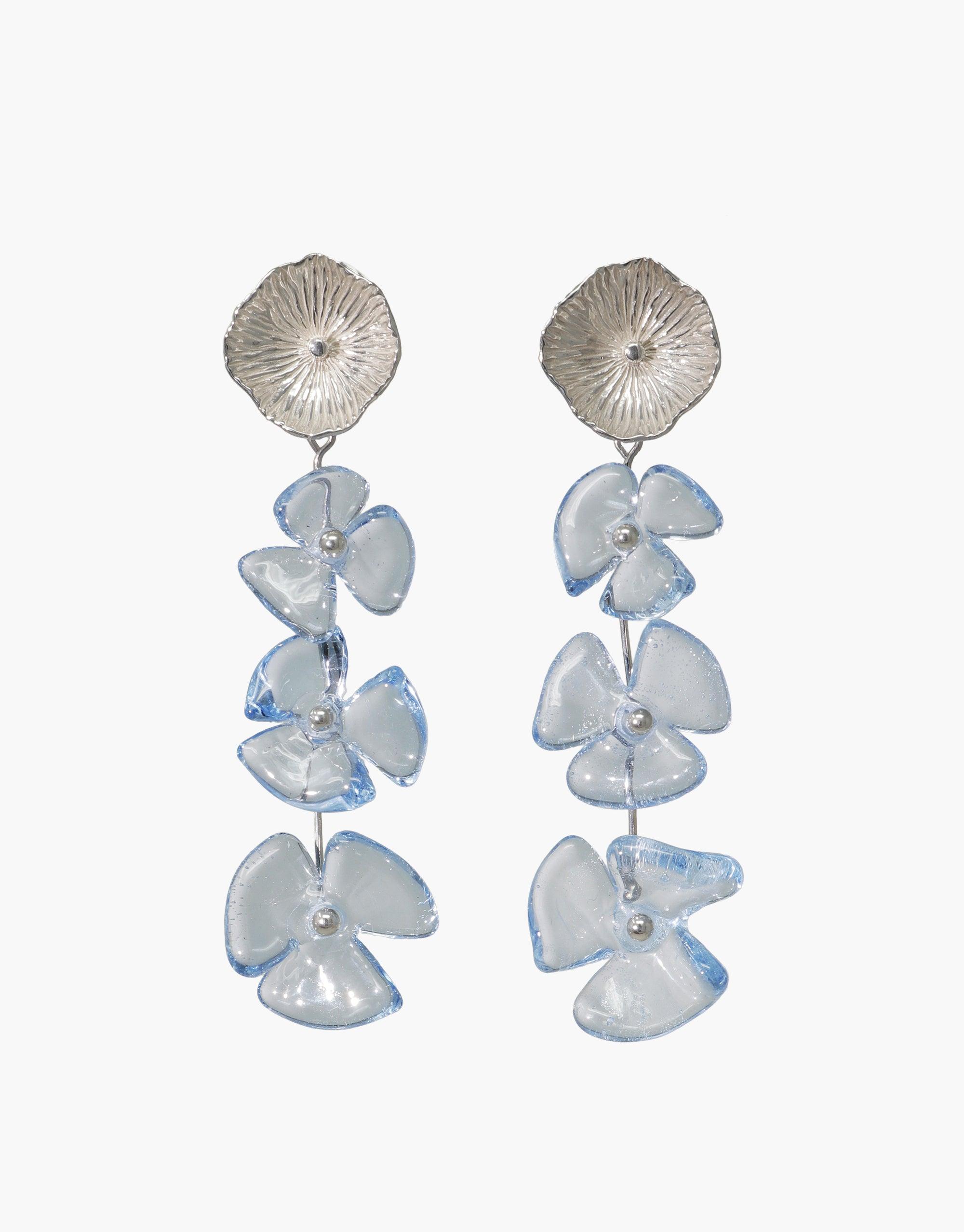 Elegant Periwinkle Trio Earrings featuring silver studs with cascading light blue glass flower drops, handcrafted from eco-friendly repurposed materials. Delicate and unique design perfect for sustainable fashion lovers. Handmade in Los Angeles by CLED.