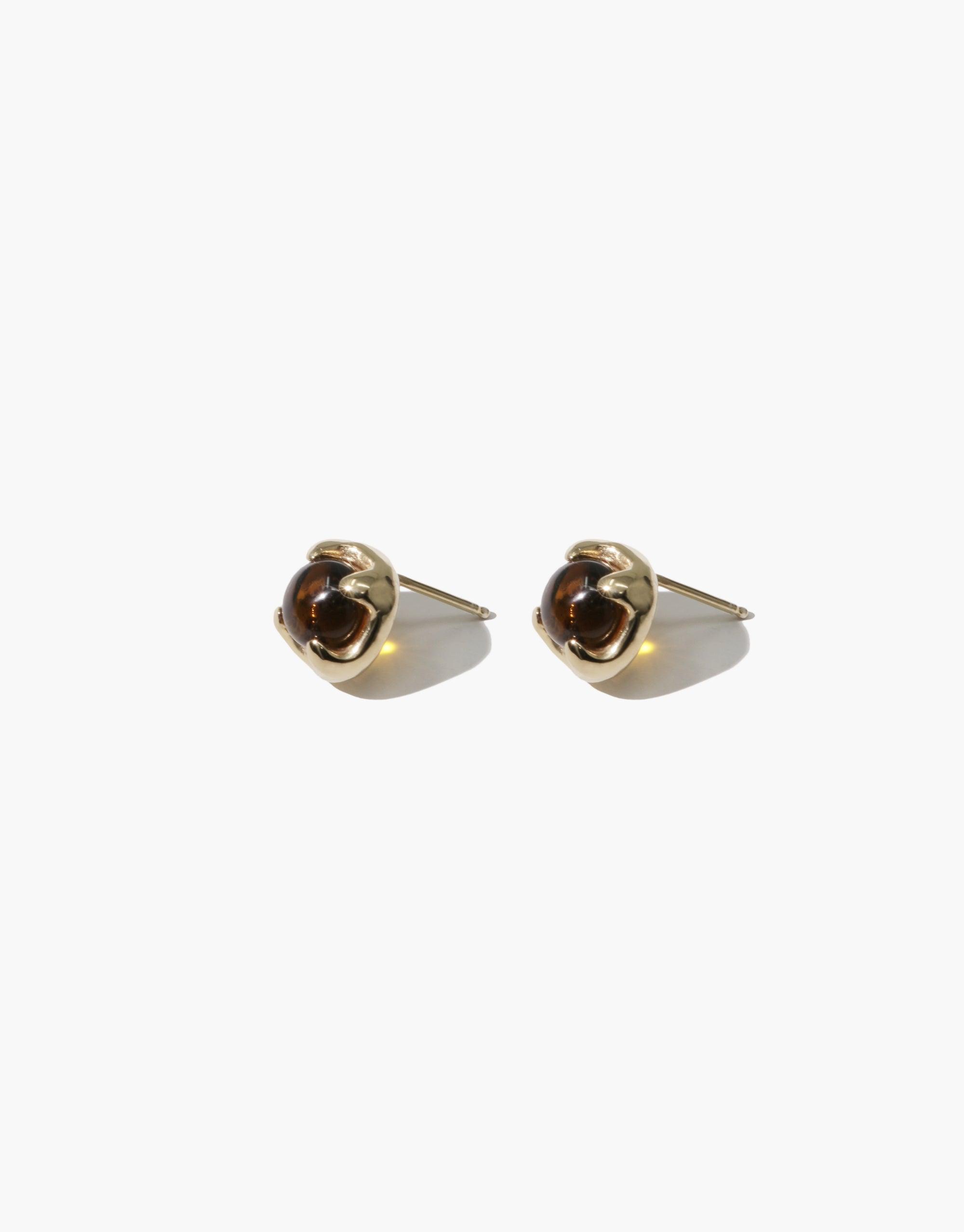 Beam Earrings: Elegant gold-toned stud earrings with curved, geometric design. Handcrafted eco-friendly jewelry featuring recycled glass gems. Sustainable and stylish accessory for a prismatic look. CLED
