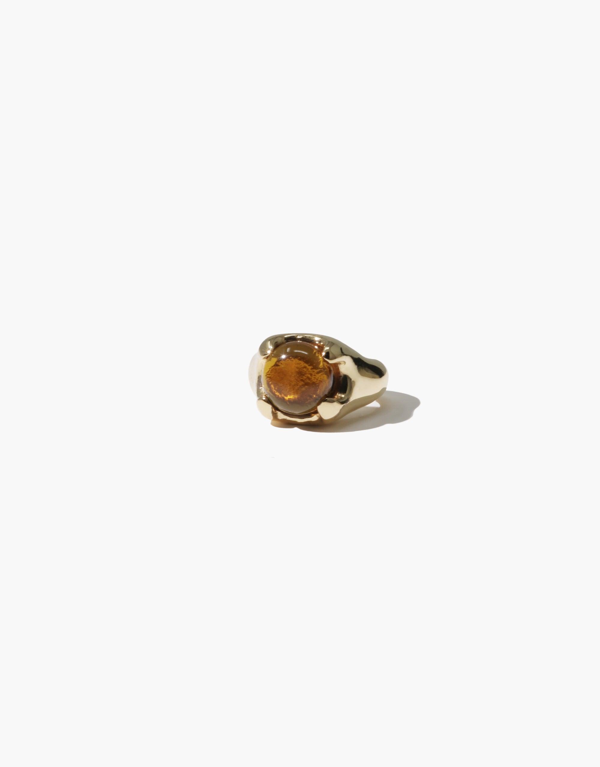 Beam Ear Cuff featuring a golden-hued eco gem set in a sleek, modern design. Handcrafted from upcycled glass, this stunning piece showcases sustainable luxury and prismatic beauty. Perfect for adding a touch of eco-conscious glamour to any outfit. CLED