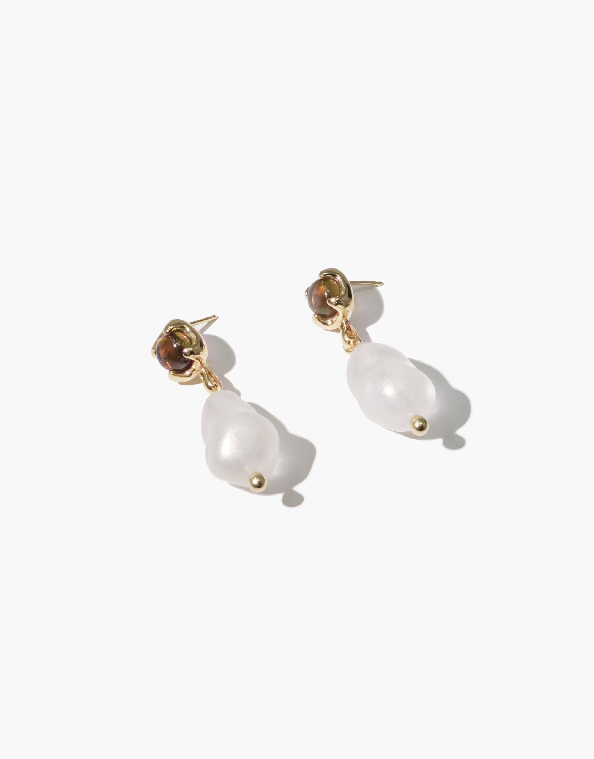 Beam Pearl Earrings featuring gold-toned studs with dangling white teardrop-shaped pearls. Elegant and minimalist design showcasing the beauty of natural pearls. Handcrafted jewelry perfect for both casual and formal occasions. CLED