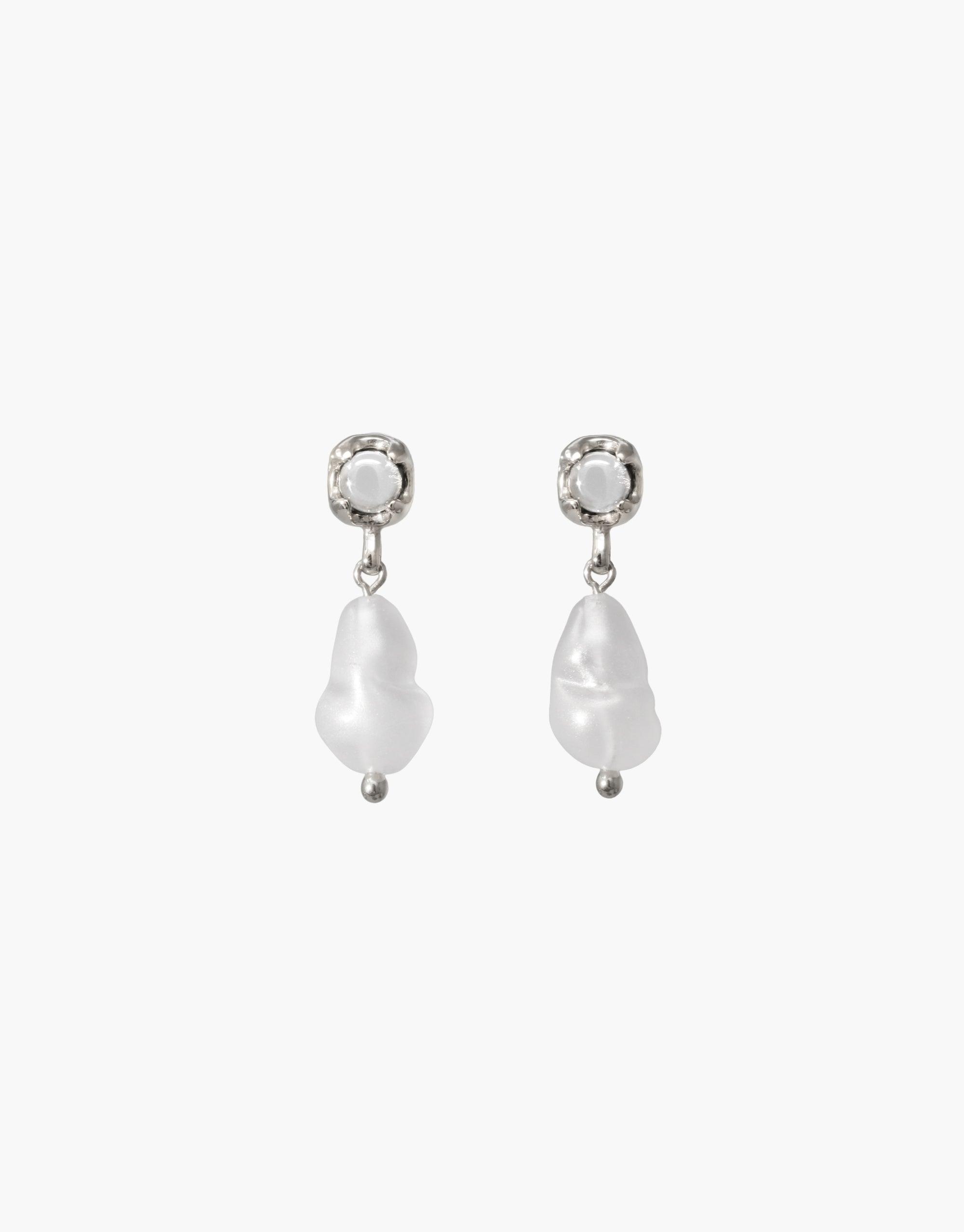 Elegant Beam Pearl Earrings featuring delicate pearl drops suspended from crystal-like studs. Handcrafted design showcasing sustainable materials and timeless beauty. Perfect for adding a touch of sophistication to any outfit. CLED Beam Pearl Earrings.