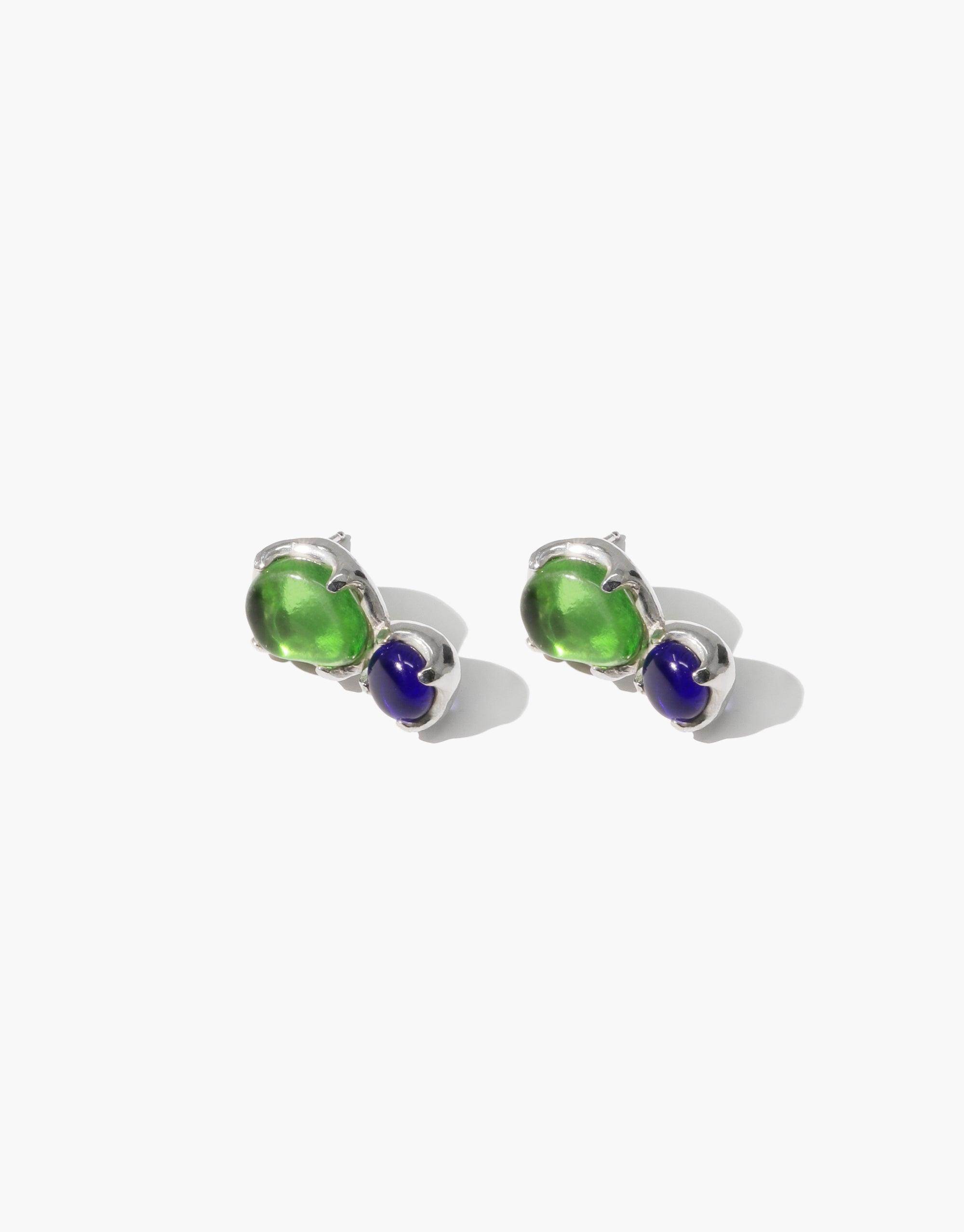 Duo Beam Earrings featuring green and blue eco gems made from upcycled glass, set in silver. Elegant studs showcasing sustainable design and prismatic colors. Handcrafted jewelry by CLED.