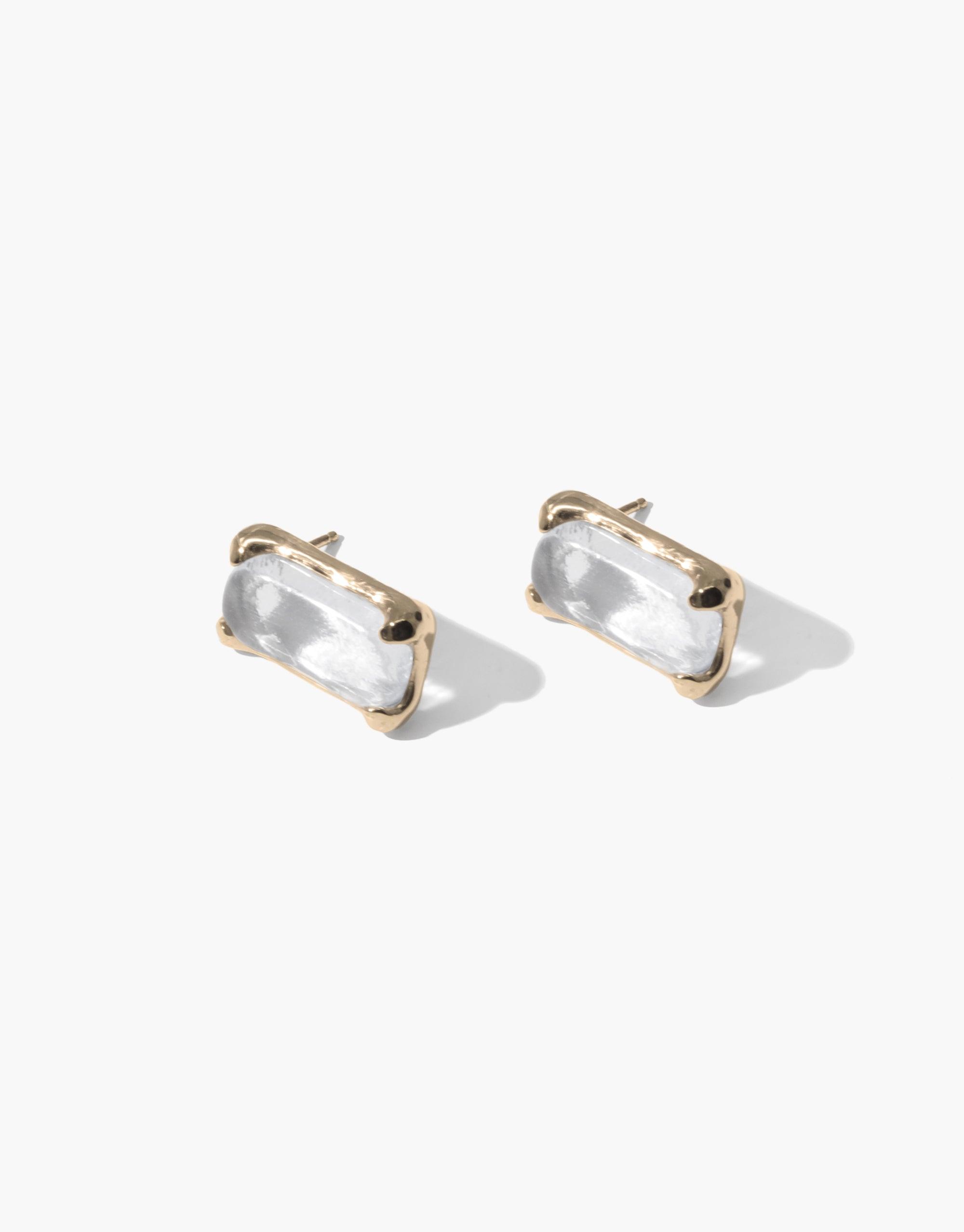 Elegant Prism Earrings featuring rectangular clear eco gems set in gold-toned metal, showcasing sustainable luxury and light-refracting beauty. Handcrafted design perfect for eco-conscious fashion lovers seeking unique, versatile accessories. CLED Prism Earrings.