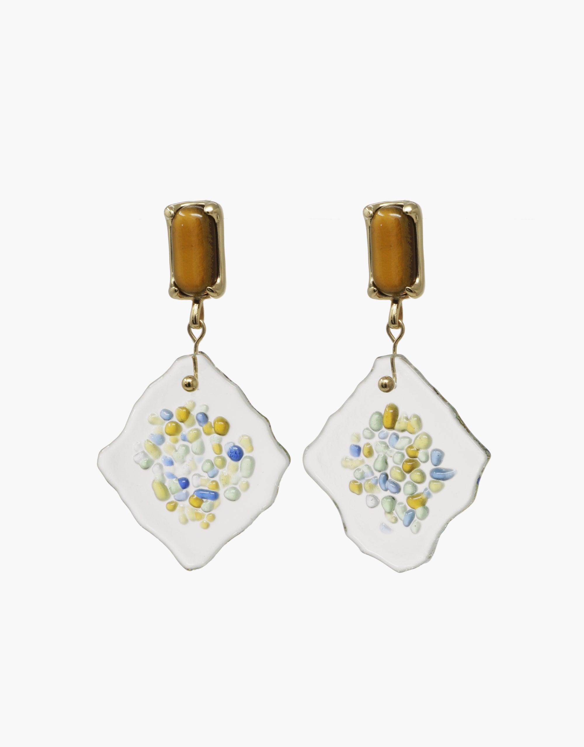 Spectral Prism Earrings featuring amber-colored studs and white diamond-shaped pendants with colorful speckles, resembling a prism's light refraction. Handcrafted eco-friendly jewelry showcasing upcycled glass elements. Elegant and sustainable design by CLED.