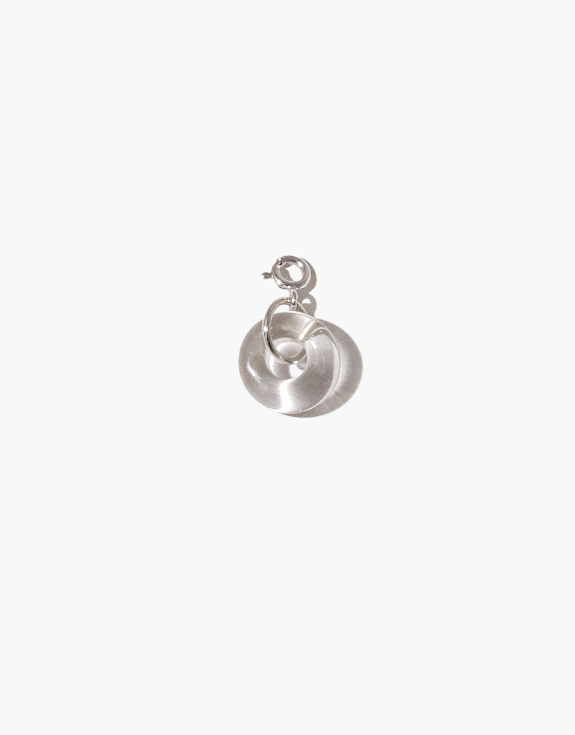 Sterling silver donut-shaped charm with a spring clasp, featuring a smooth, polished surface. Ideal for necklaces or bracelets. Handcrafted icon charm symbolizing indulgence and sweetness. Donut | Icon Charm by CLED.