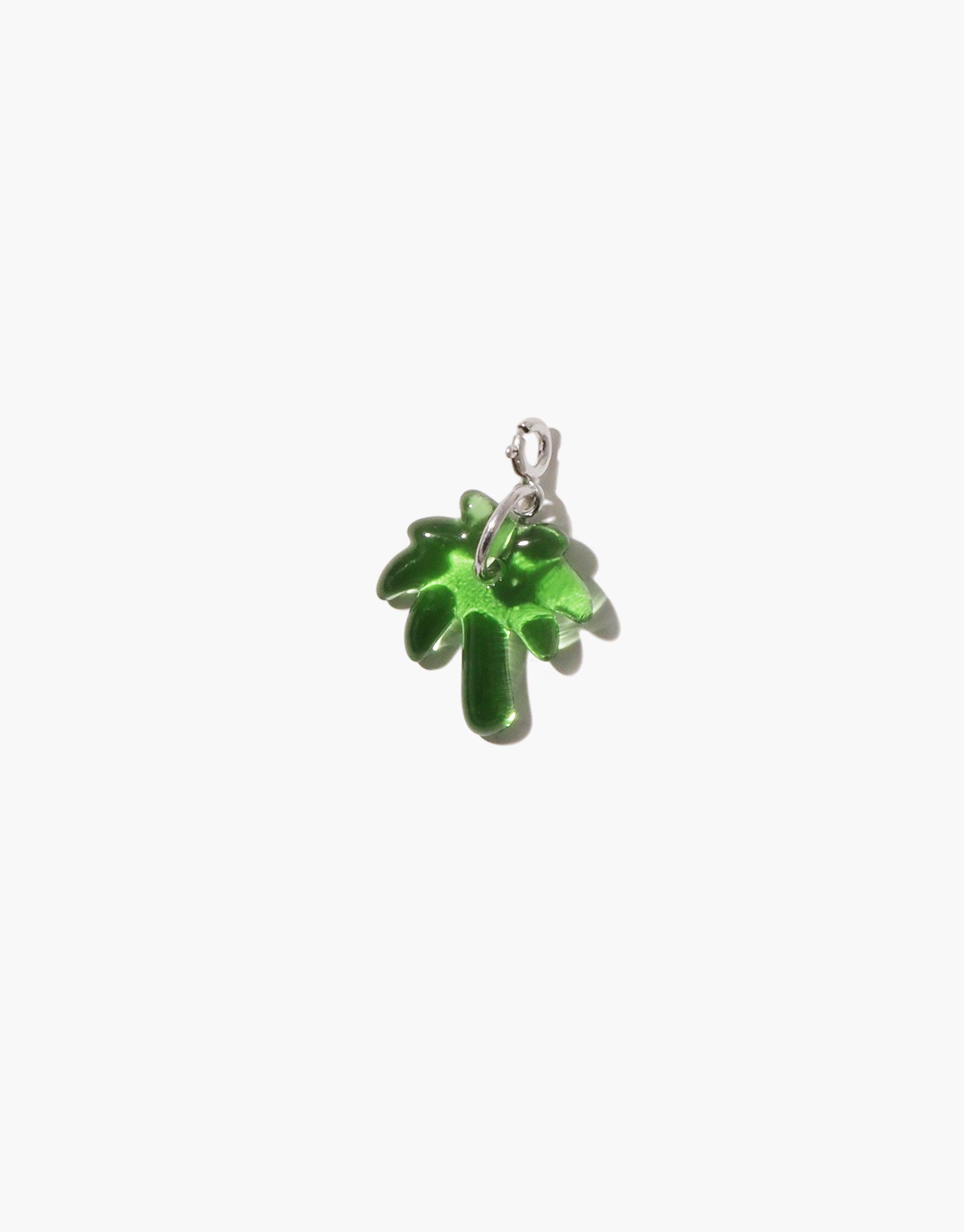 Vibrant green palm tree charm handcrafted from upcycled glass, featuring a sterling silver or gold vermeil clasp. Ideal for customizing necklaces or bracelets. Palm Tree Icon Charm by CLED, part of the eco-friendly Icon Charms collection.