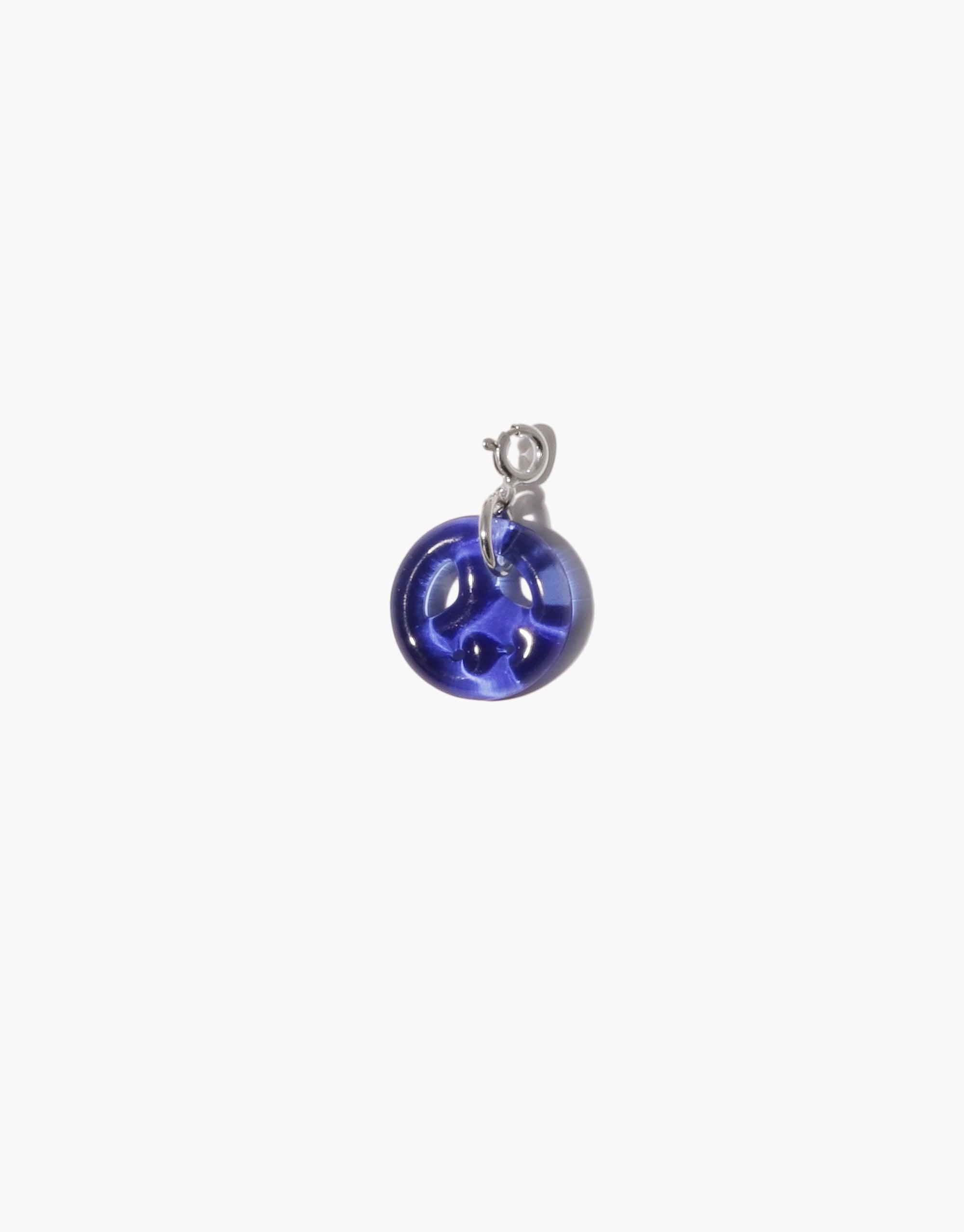 Peace Icon Charm featuring a vibrant blue glass pendant with peace symbol design, handcrafted from upcycled eco-friendly materials. Sterling silver or gold vermeil attachment. Versatile accessory for necklaces or bracelets. Unique, sustainable jewelry piece by CLED.