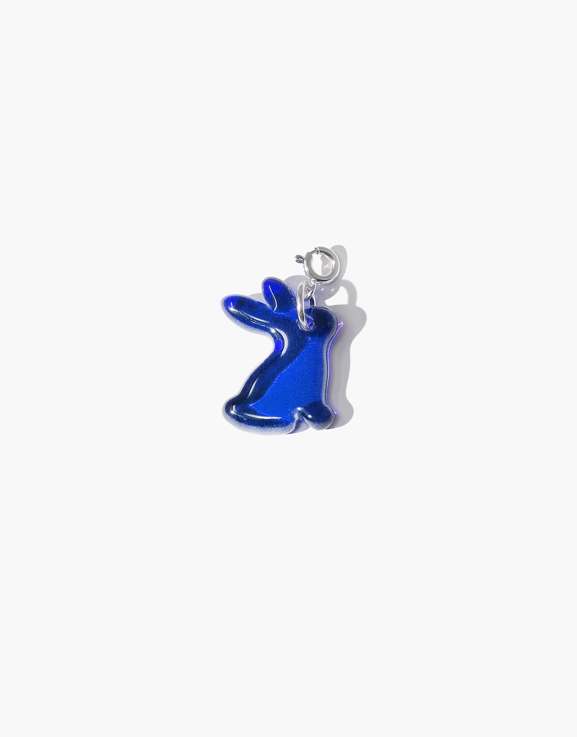 Vibrant blue rabbit-shaped charm with silver clasp, handcrafted from upcycled glass for Lunar New Year. Stylish eco-friendly jewelry piece. Rabbit Icon Charm by CLED.