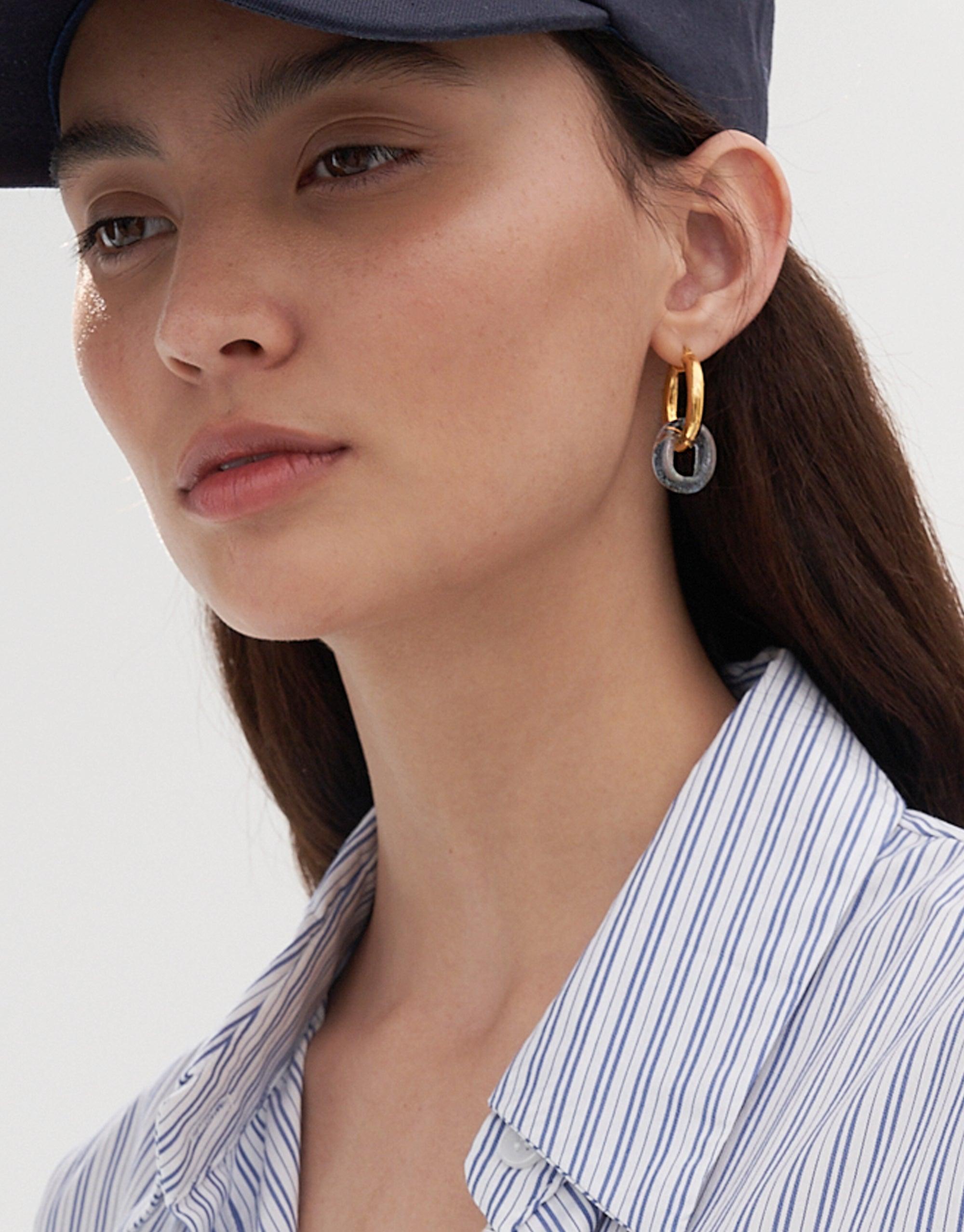 Close-up of large gold hoop earrings with unique eco gem loop detail, showcasing the "In The Loop Hoops | Large" design. Elegant and sustainable jewelry piece made from repurposed glass bottles, handcrafted in Los Angeles by CLED.