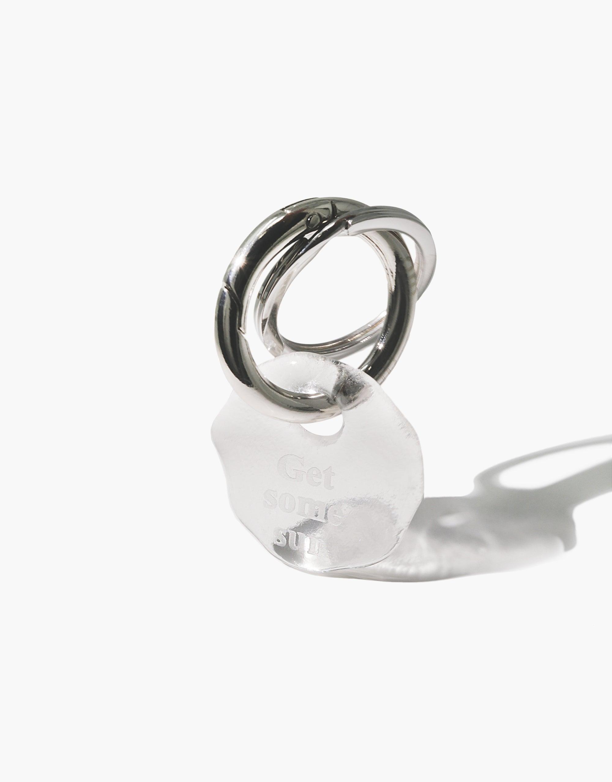 Messenger Keyring with clear glass charm engraved "Get some sun" message, attached to stainless steel ring. Eco-friendly handmade accessory for daily inspiration. Messenger Keyring | Get some sun by CLED