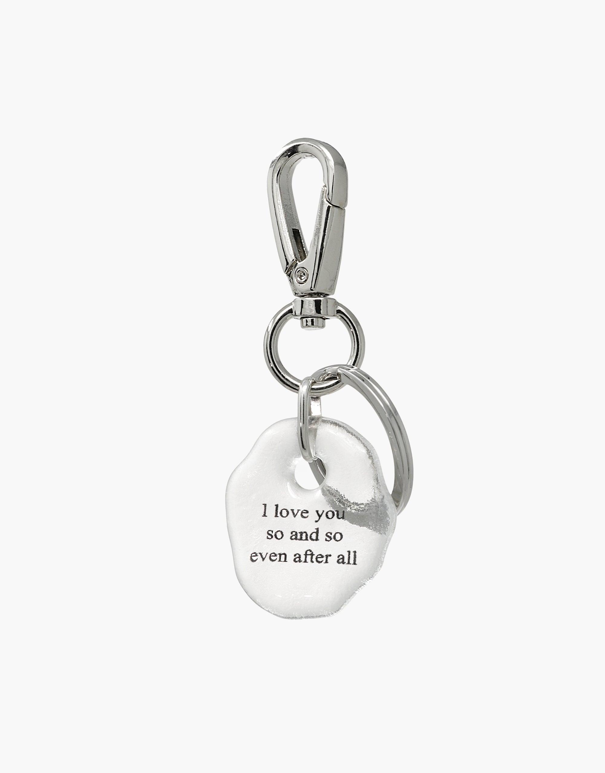 Messenger Keyring | Love featuring a silver carabiner clip attached to a clear glass charm engraved with "I love you so and so even after all". Handmade eco-friendly keyring with a message of love and connection. CLED