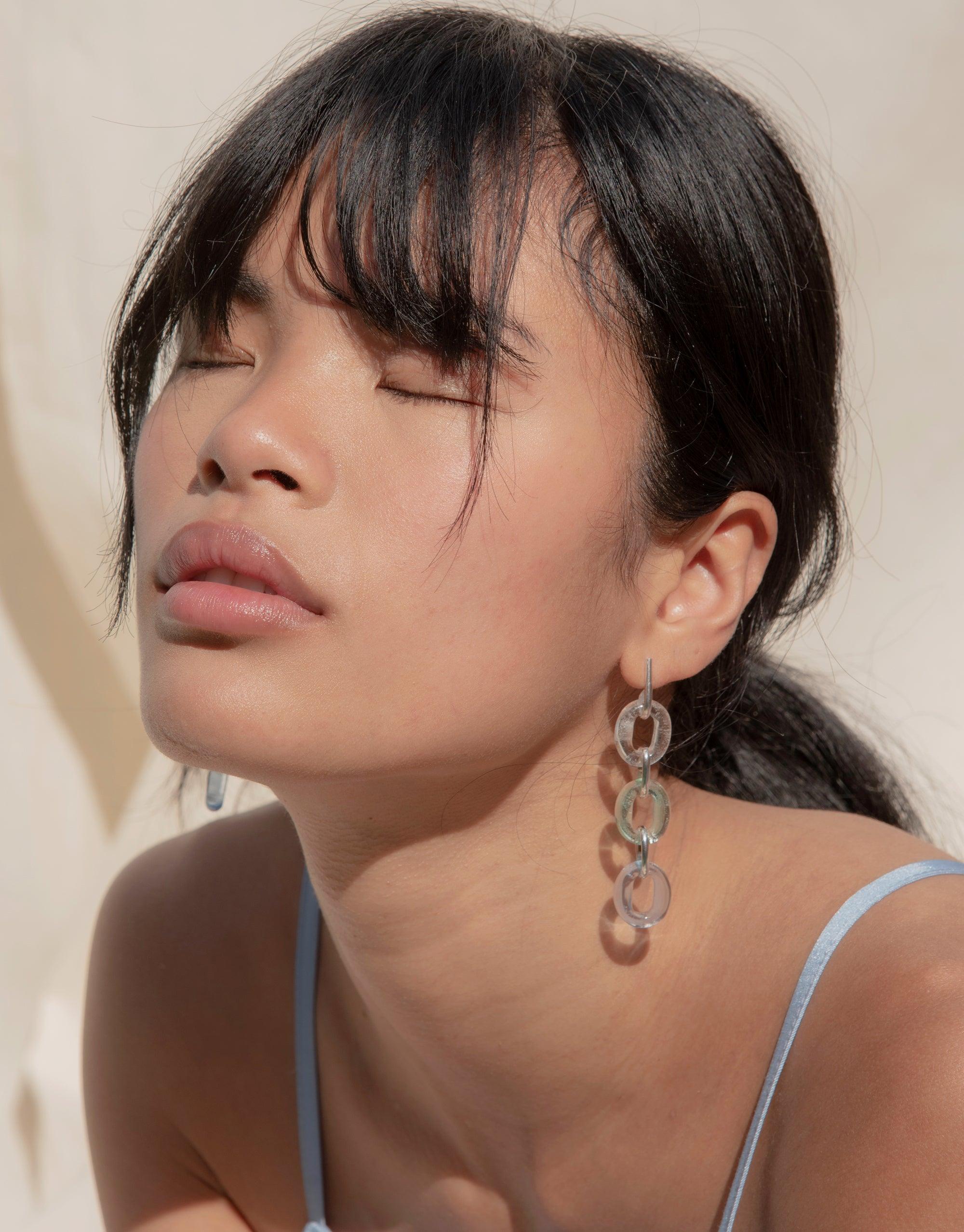 Stylish trio loop earrings with sky blue eco-friendly glass, showcasing sustainable elegance. Sterling silver design adds sparkle to any outfit. Handcrafted in Los Angeles for a unique, eco-conscious accessory. ITL Trio Earrings | Sky by CLED