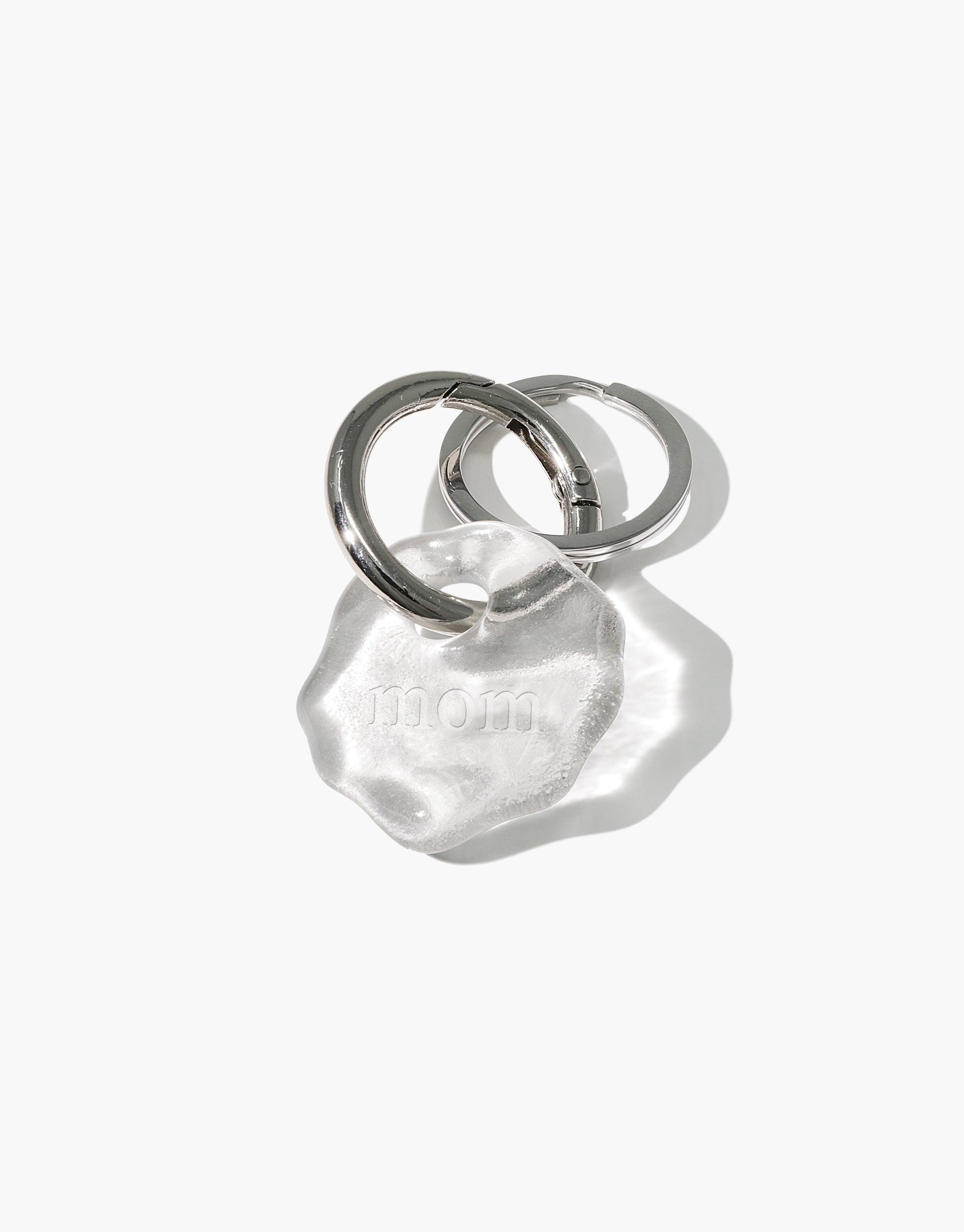 Personalized Messenger Keyring with clear eco gem charm engraved with 'mom', attached to stainless steel ring. Handmade sustainable accessory for sharing love and thoughts. Messenger Keyring | Personalized by CLED