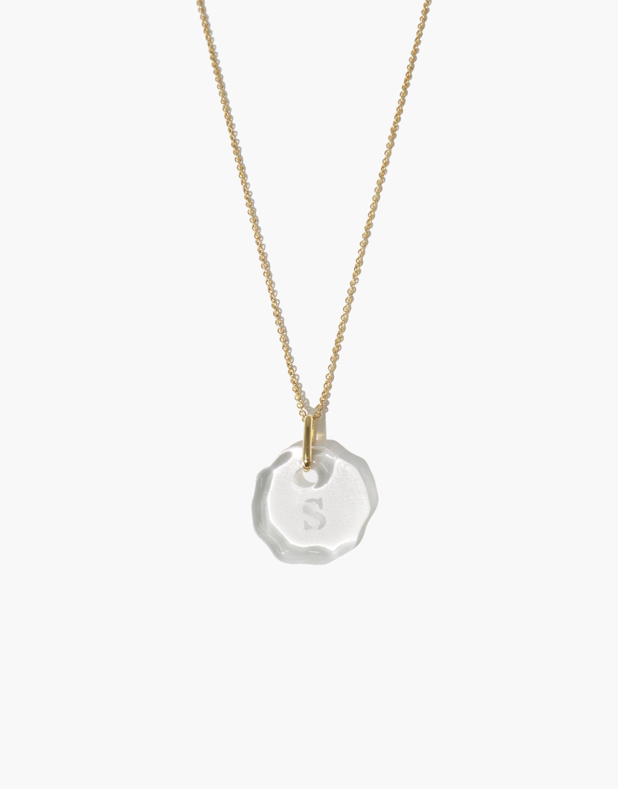 Messenger Necklace with clear engraved eco gem pendant on gold-toned chain, featuring personalized initial. Adjustable length, handcrafted from repurposed glass. Sustainable jewelry piece by CLED. Messenger Necklace | Clear Engraving