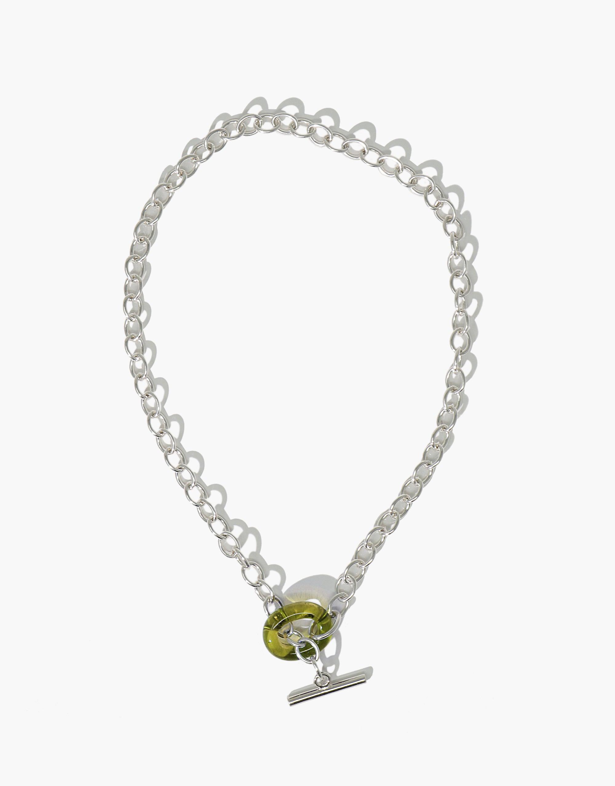 Elegant ITL Toggle Choker Necklace with interlocking silver links and green eco gem loop closure. Handcrafted sustainable jewelry featuring recycled glass. Adjustable length for versatile wear. Stylish and eco-friendly accessory by CLED.