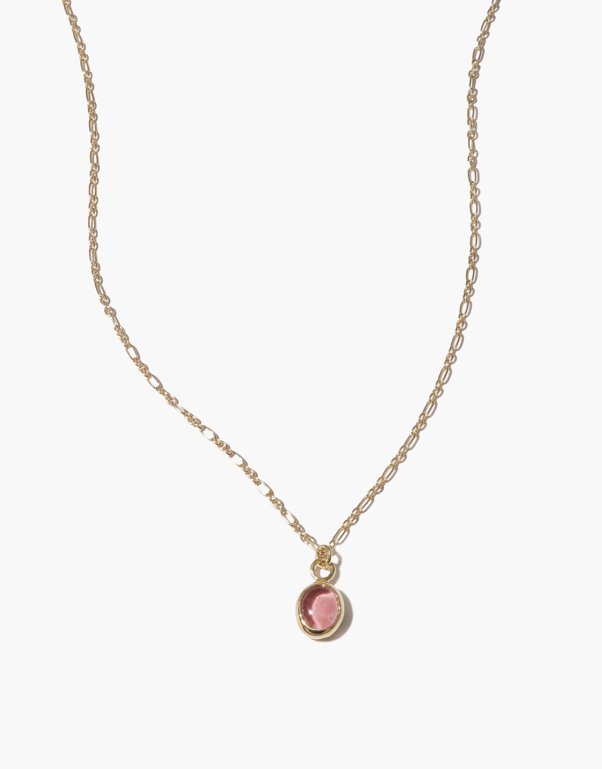 Delicate gold chain necklace with small oval pink charm pendant, featuring handcrafted design and adjustable length. Elegant and minimalist Oval Charm Necklace perfect for layering or wearing alone. Sustainable jewelry piece by CLED.