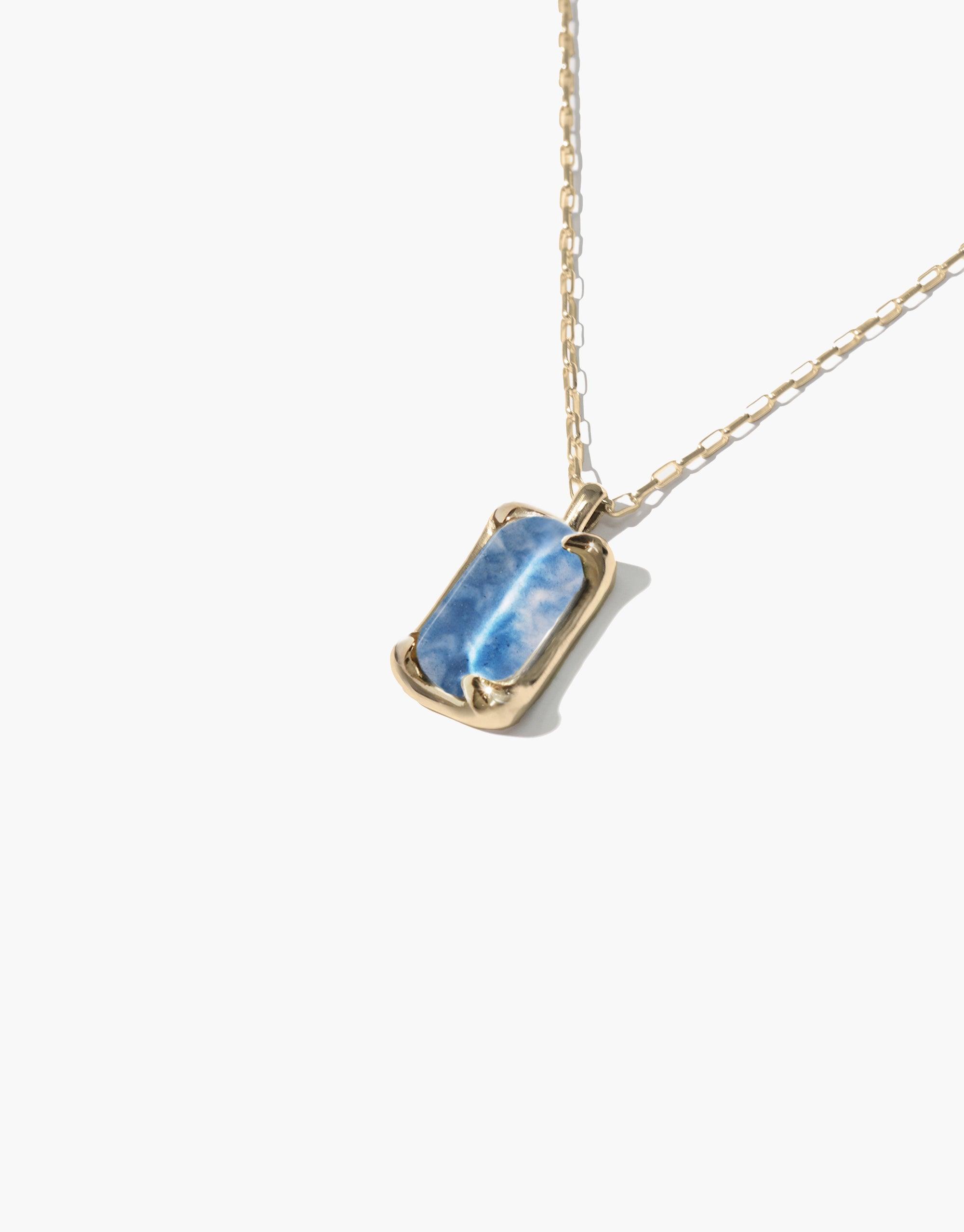 Elegant Prism Necklace featuring a blue marble-effect upcycled glass pendant on a delicate gold chain. Handcrafted eco-friendly jewelry showcasing sustainable luxury and unique artisanal design. Prism Necklace | Marble by CLED