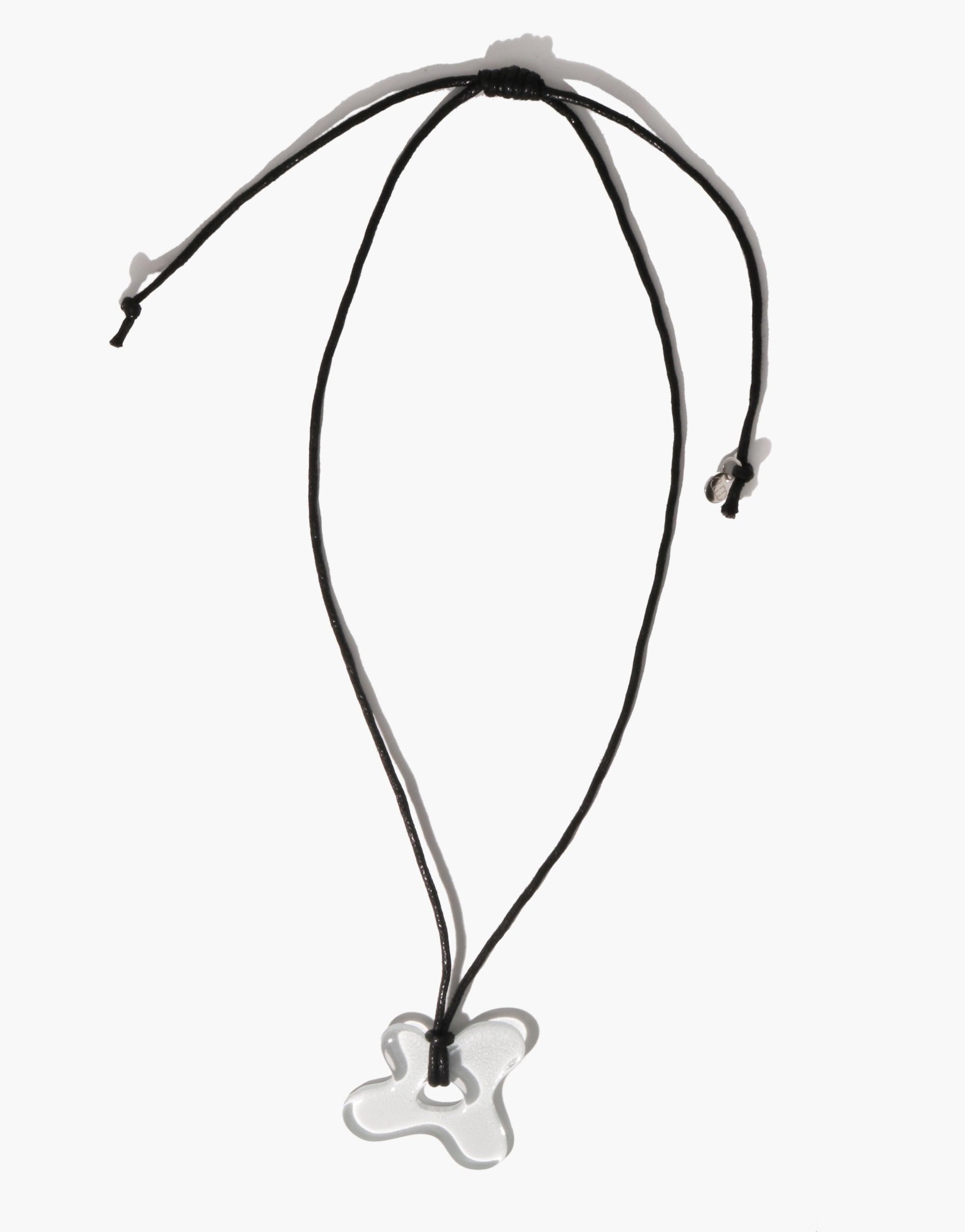 Sculptural Large Charm Necklace | C featuring a unique glass pendant on a black cord. Handcrafted from recycled window glass, this necklace showcases an artistic, abstract charm design. Sustainable and stylish accessory by CLED.
