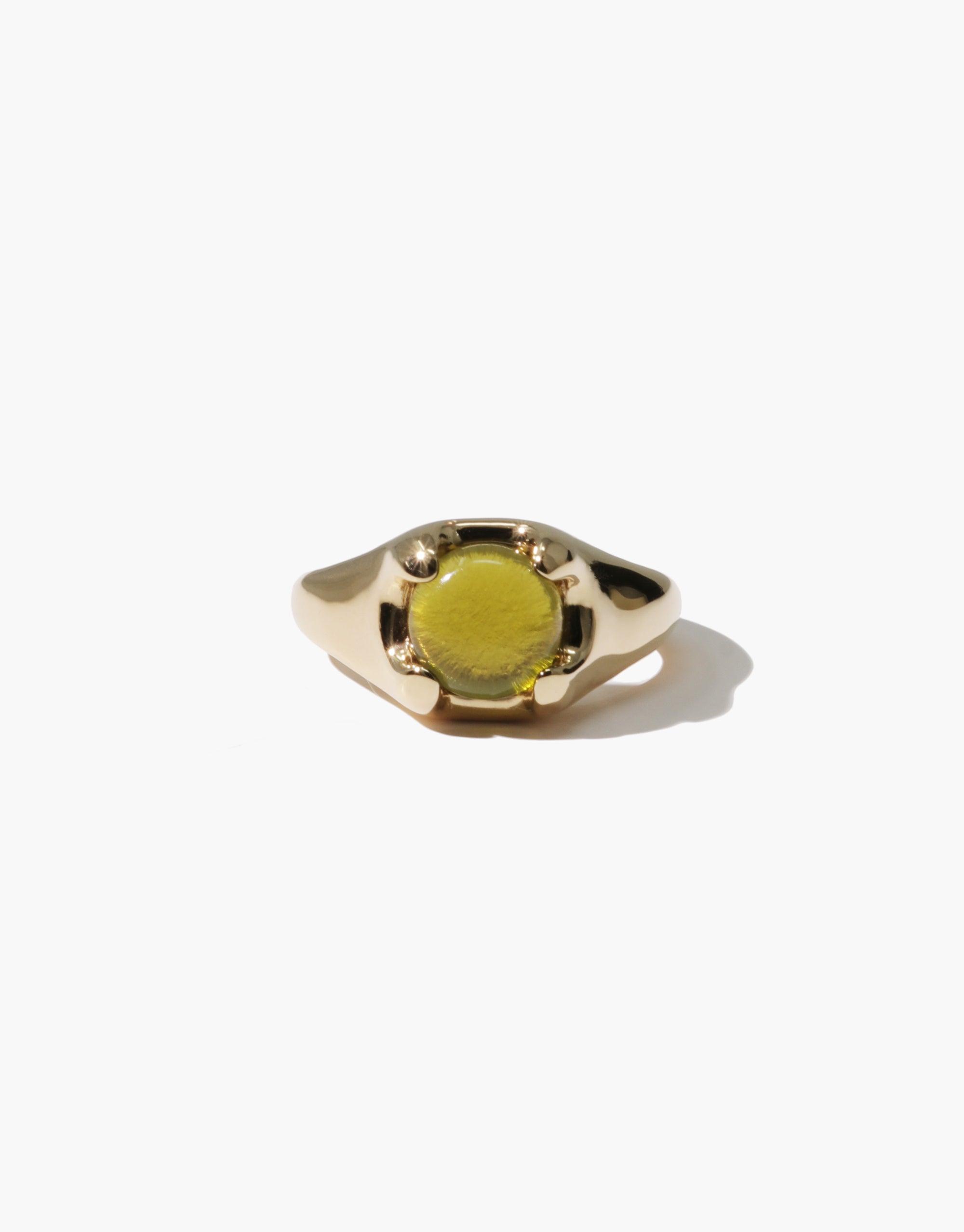 Gold-toned Beam Ring featuring a round yellow eco gem set in a sleek, modern design. Handcrafted jewelry piece showcasing sustainable materials and elegant simplicity. Perfect for eco-conscious fashion lovers. CLED