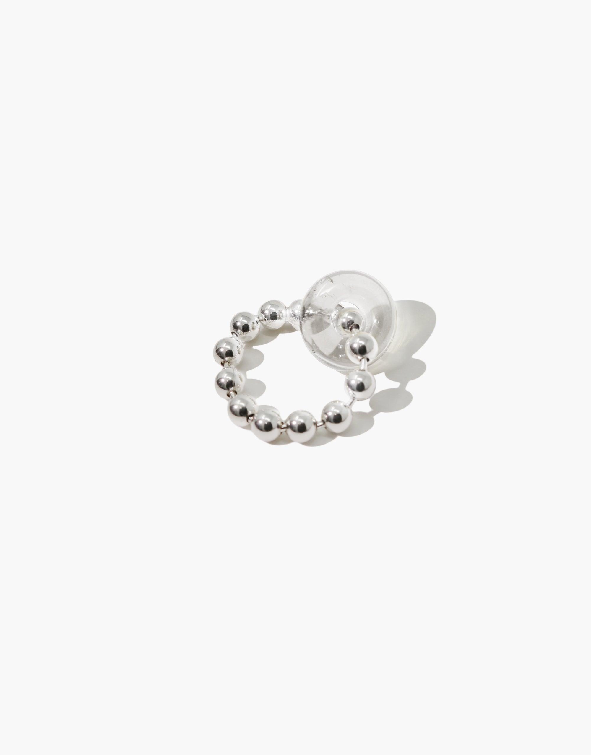 Elegant Donut Ball Ring featuring a circular design with silver beads and a transparent spherical accent, showcasing handcrafted eco-friendly jewelry made from repurposed glass. Stylish and sustainable accessory by CLED.