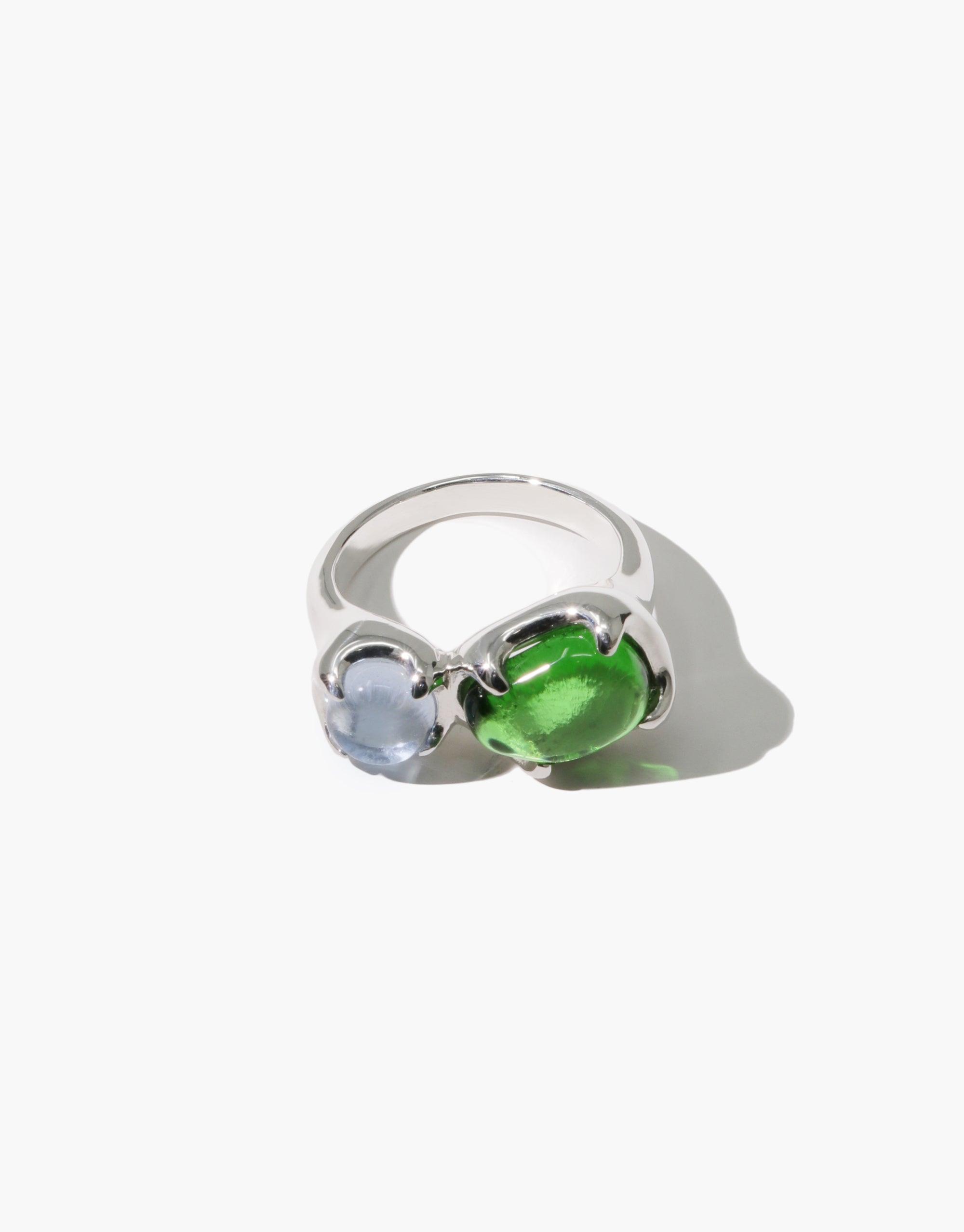 Duo Beam Ring featuring two eco gems in green and blue, set on a silver band. Elegant and sustainable jewelry piece showcasing upcycled glass in a prism-inspired design. Handmade ring reflecting spectral colors and environmental consciousness. CLED