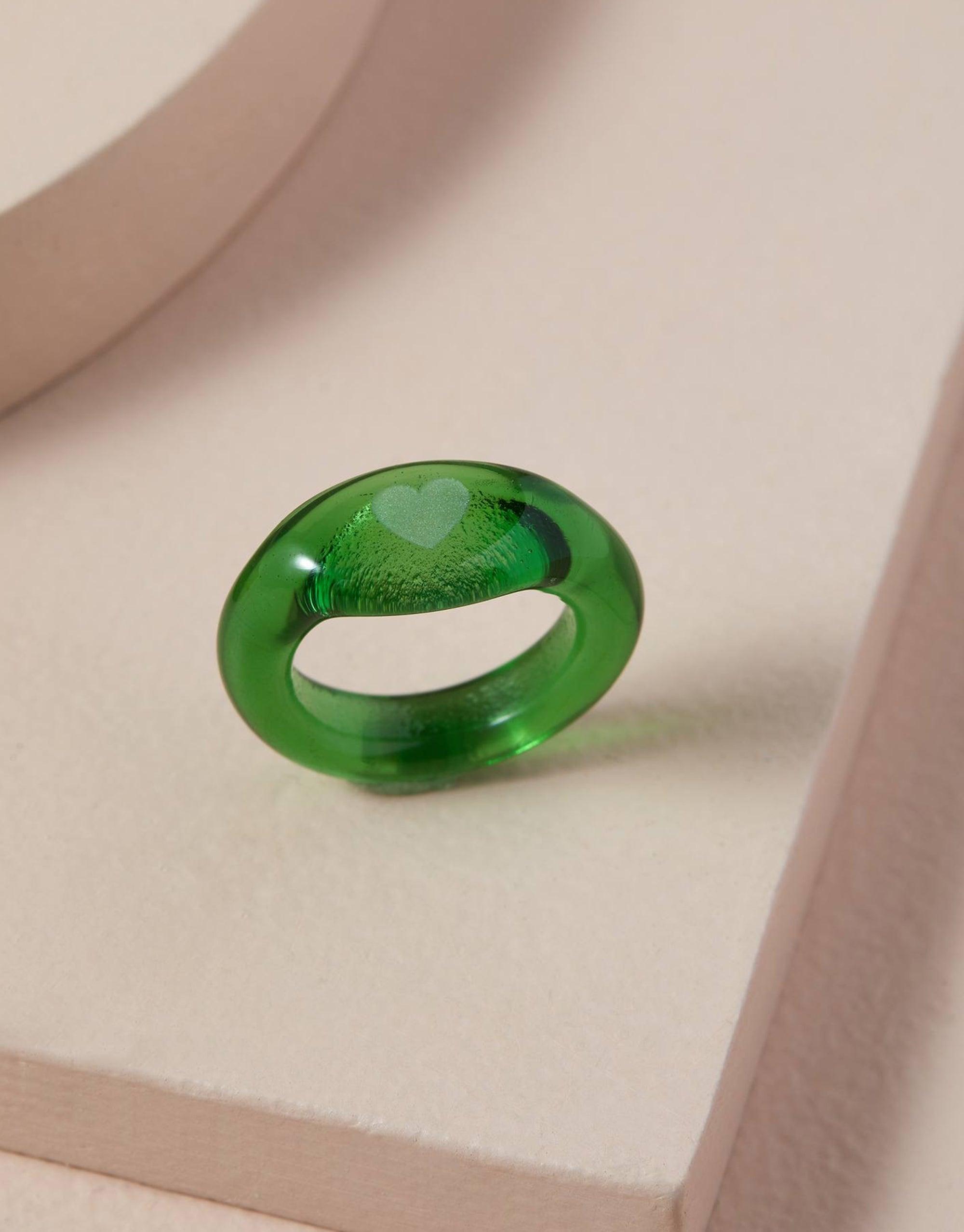 Heart Signet Ring in vibrant green eco glass, featuring a clear engraved heart symbol. Handcrafted sustainable jewelry piece from The Messenger Collection, showcasing love and connection. Unique, eco-friendly design by CLED.