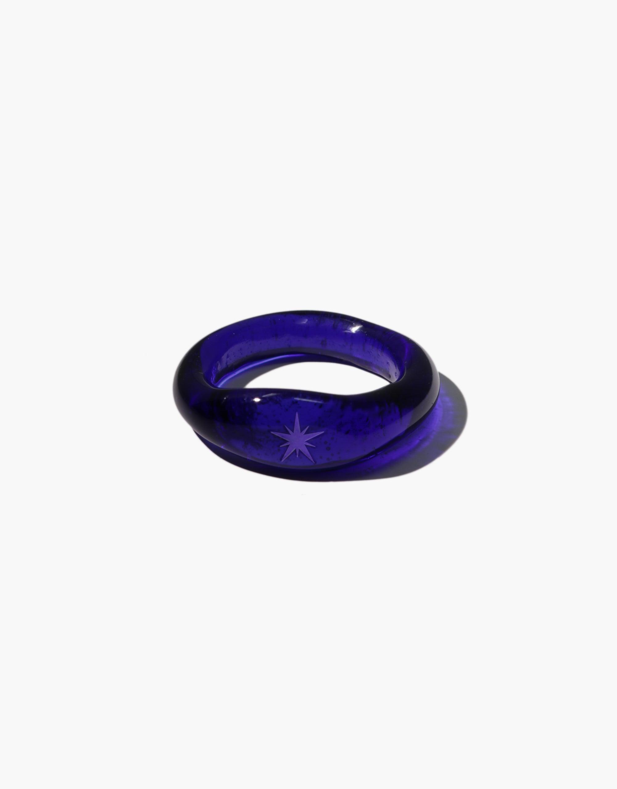 Star Signet Ring featuring a clear engraved star design on a blue Eco Gem, hand-formed from repurposed glass. Reflects CLED's eco-conscious craftsmanship and connection-themed Messenger Collection.
