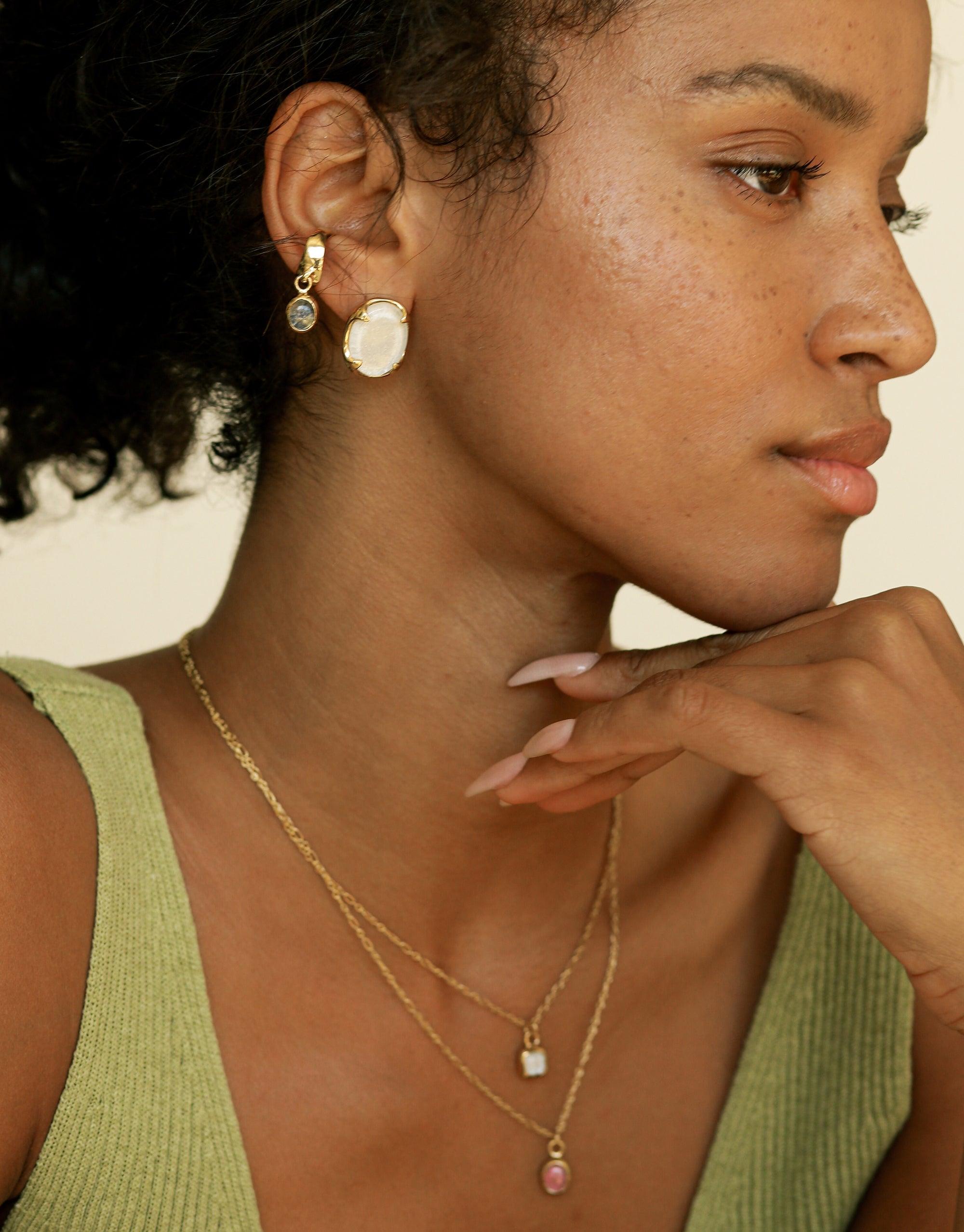 Square Charm Necklace on a woman, showcasing delicate sterling silver or 24K gold vermeil chain with eco-friendly charms made from upcycled glass, highlighting sustainable, handcrafted elegance from CLED.