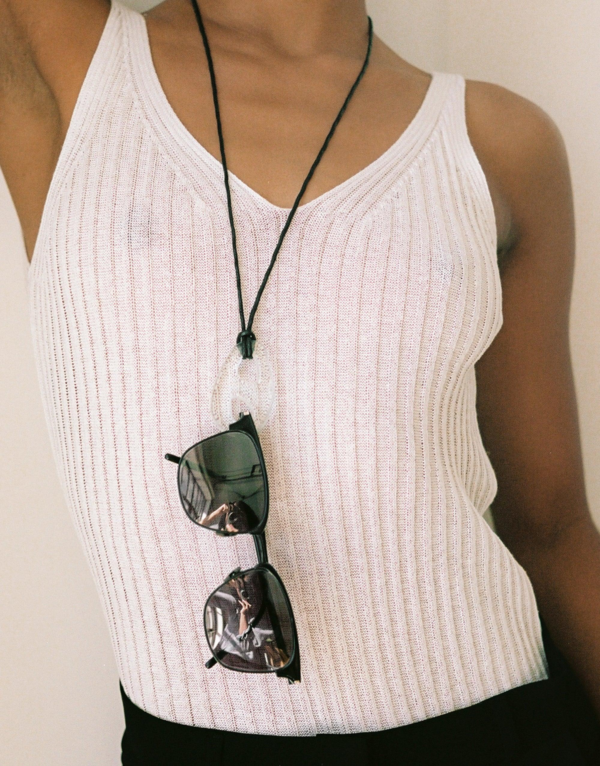 Sculptural Large Charm Necklace with upcycled glass pendant on adjustable cotton cord, worn with white ribbed tank top and sunglasses. Eco-friendly handmade jewelry by CLED. Sculptural Large Charm Necklace | B