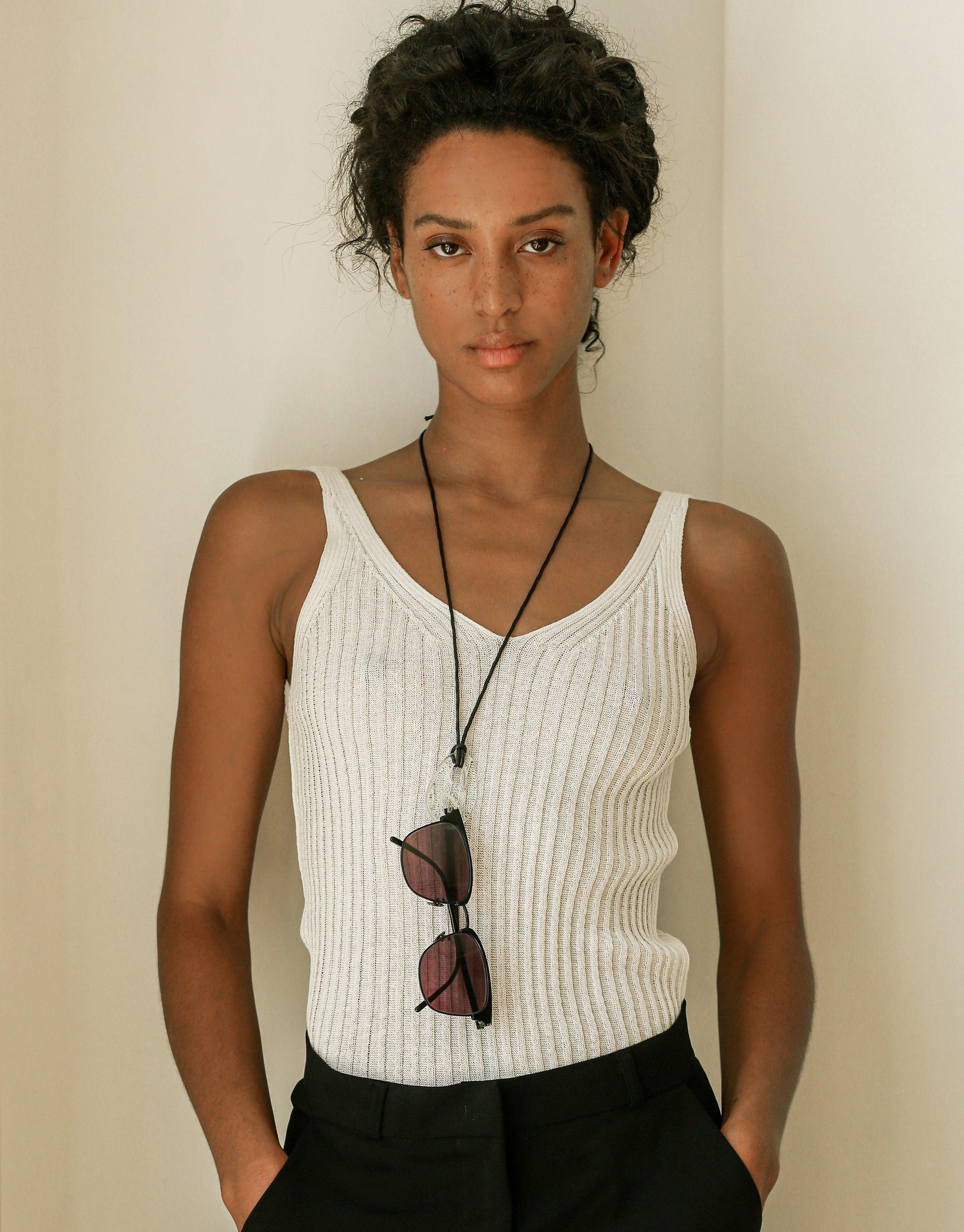 Sculptural Large Charm Necklace | B featuring upcycled glass charm on adjustable cotton cord, displayed on model wearing white tank top and dark trousers, showcasing eco-friendly handmade jewelry design by CLED