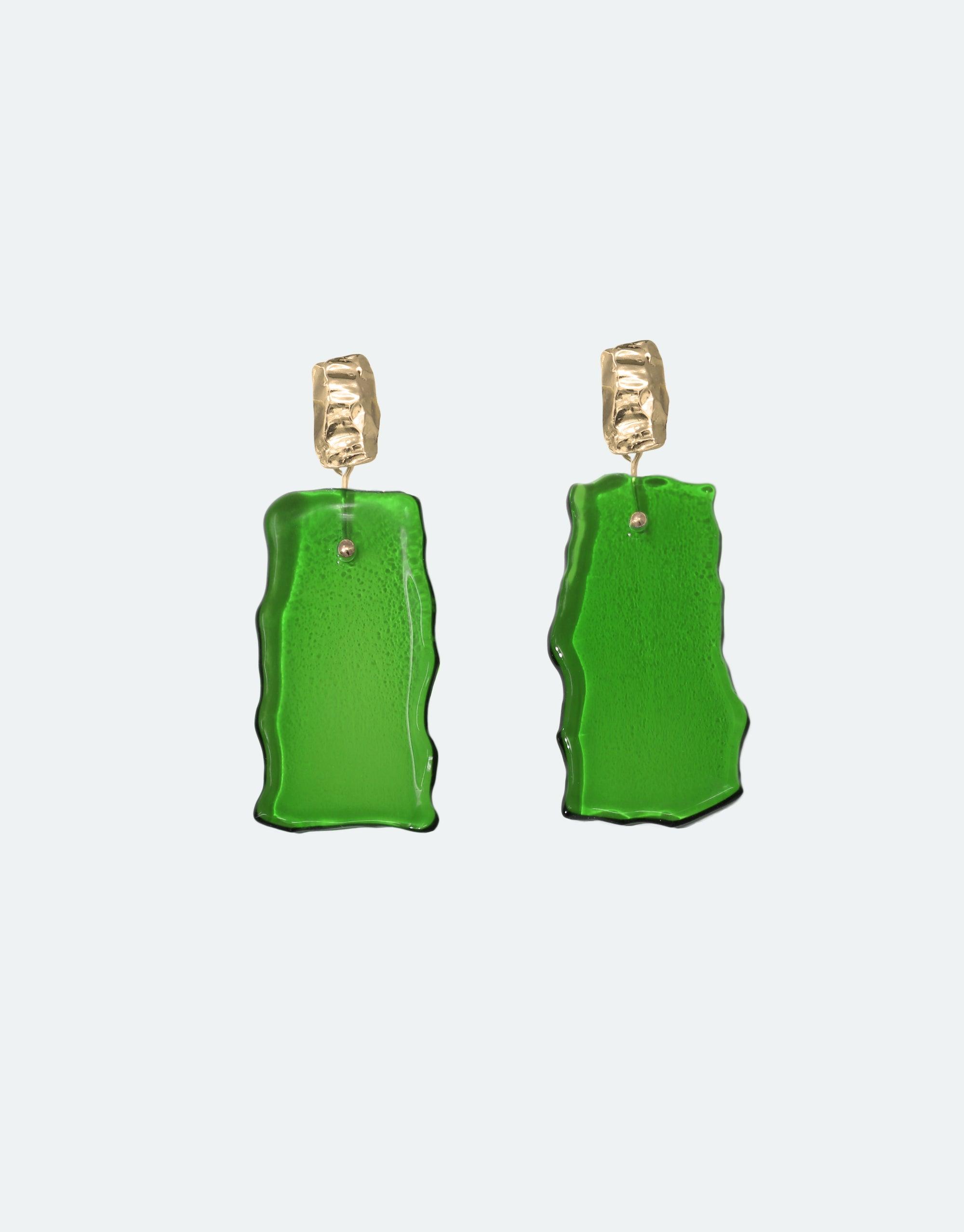 Afloat Earrings featuring vibrant green, hand-formed eco gem pendants made from repurposed glass bottles, suspended from gold vermeil studs. Inspired by melting glaciers, these elegant, organic-shaped earrings symbolize climate change awareness. Handcrafted, sustainable jewelry by CLED.