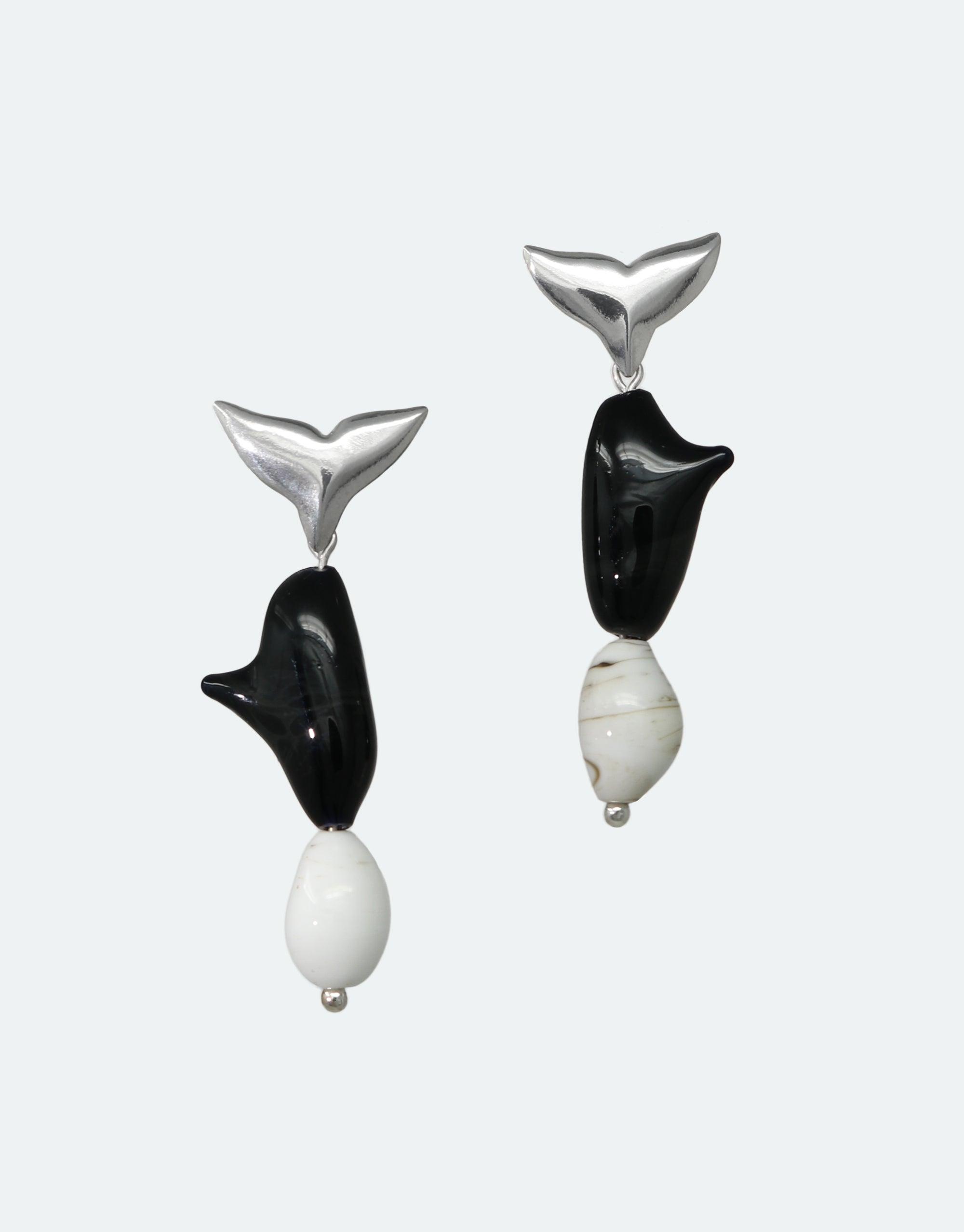 Elegant Orca Earrings featuring silver whale tail studs with black and white body segments, inspired by marine conservation. Handcrafted eco-friendly jewelry from recycled materials. Stylish and sustainable accessories for ocean lovers. Orca Earrings by CLED