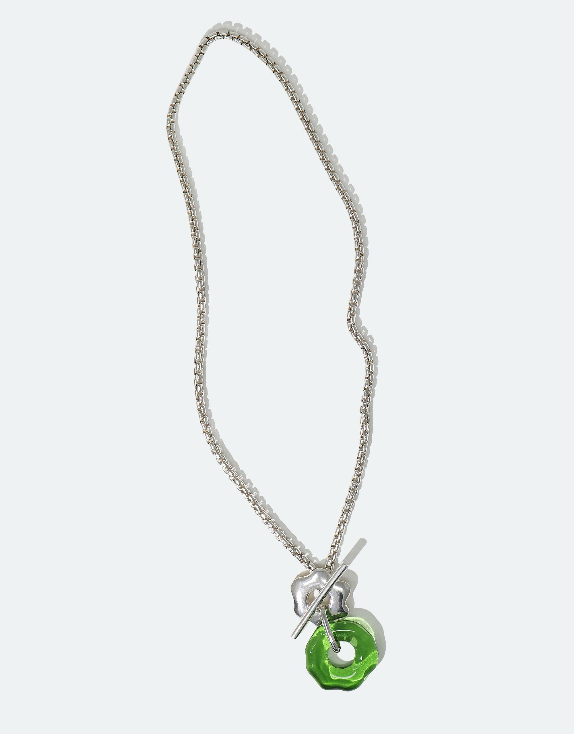 Elegant Avens Toggle Necklace featuring a silver chain and green recycled glass pendant, inspired by Arctic flora. Sustainable jewelry design with versatile toggle closure for multiple styling options. Handcrafted eco-friendly accessory by CLED.