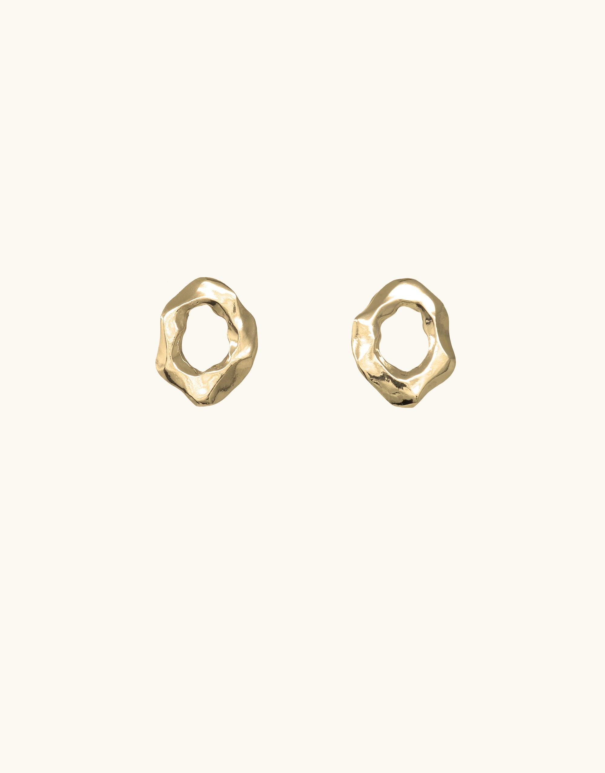 Canyon Stud Earrings featuring abstract molten forms inspired by canyon terrain. Gold-toned metal with organic, irregularly shaped circular design. Handcrafted jewelry piece from the Terrain Collection, showcasing unique curves and textures. Elegant and versatile accessory by CLED.
