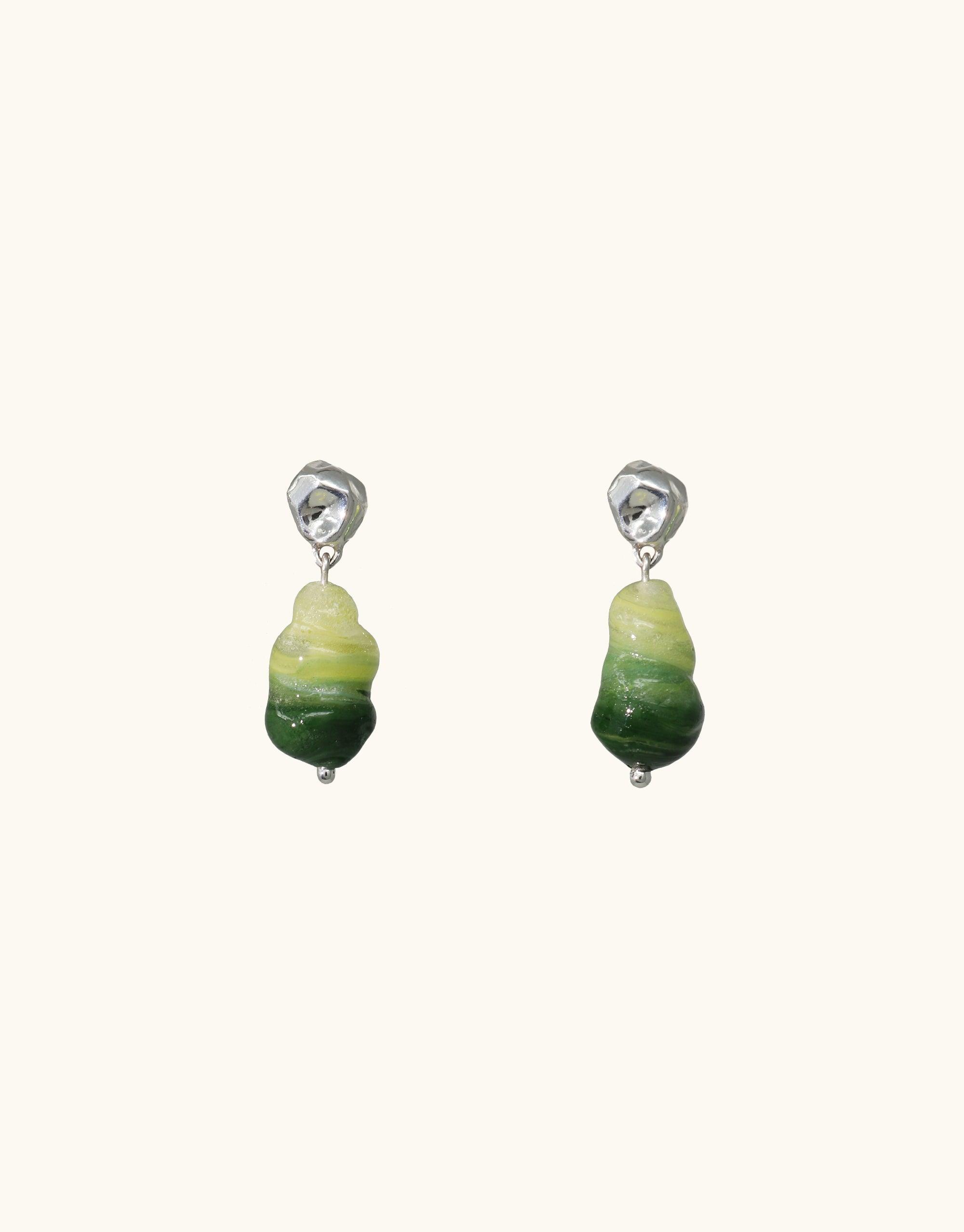 Sterling silver earrings featuring abstract, molten-shaped green glass pendants reminiscent of forest landscapes. Handcrafted eco-friendly design with gradated shades of green, embodying nature's beauty. Shades of Nature | Forest Earrings by CLED