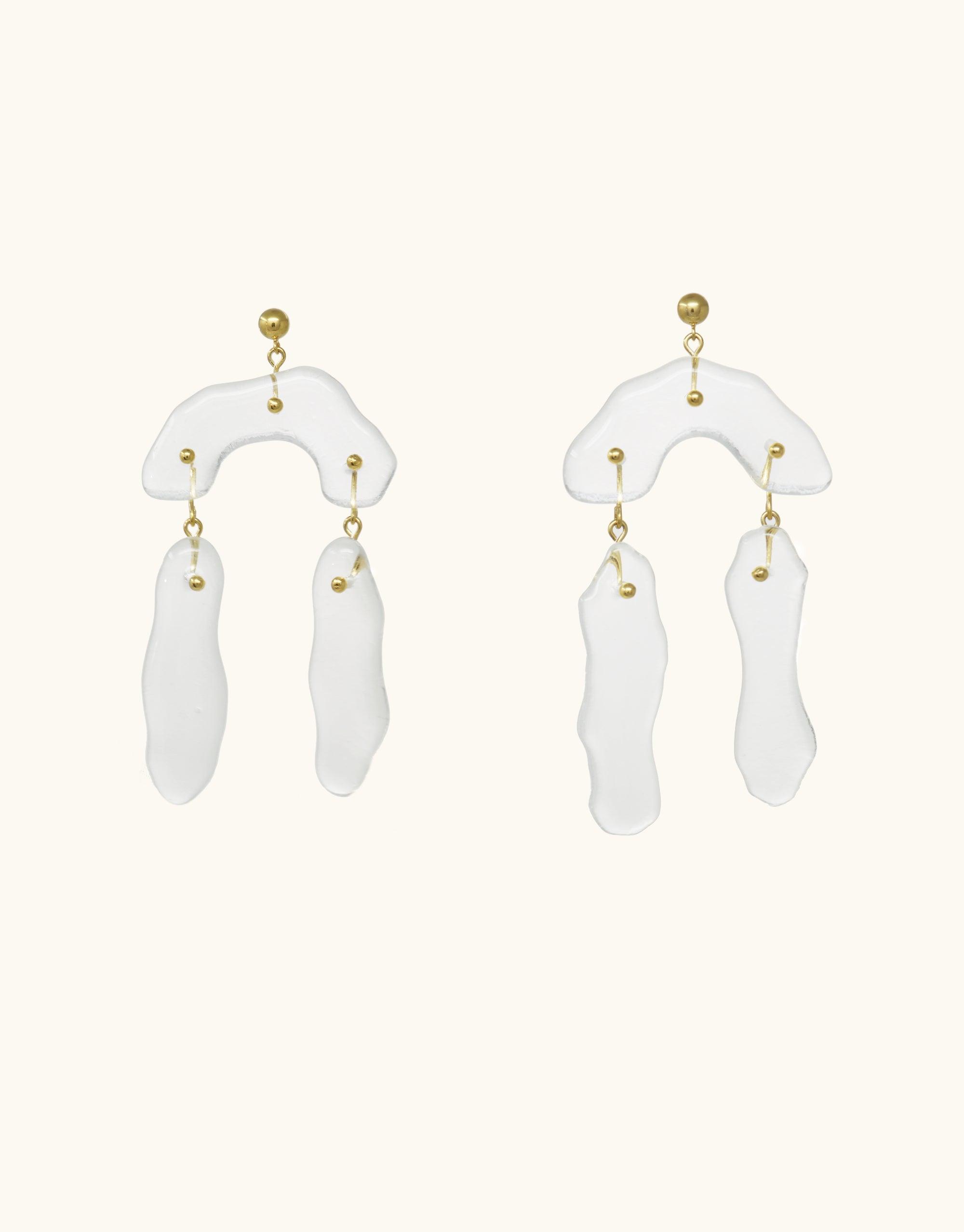 Rock Dangling Earrings featuring abstract white glass shapes inspired by canyon terrain, with gold accents. Handmade eco-friendly jewelry design showcasing unique rock formations. Elegant and eye-catching statement piece from the Terrain Collection. CLED, Rock Dangling Earrings.