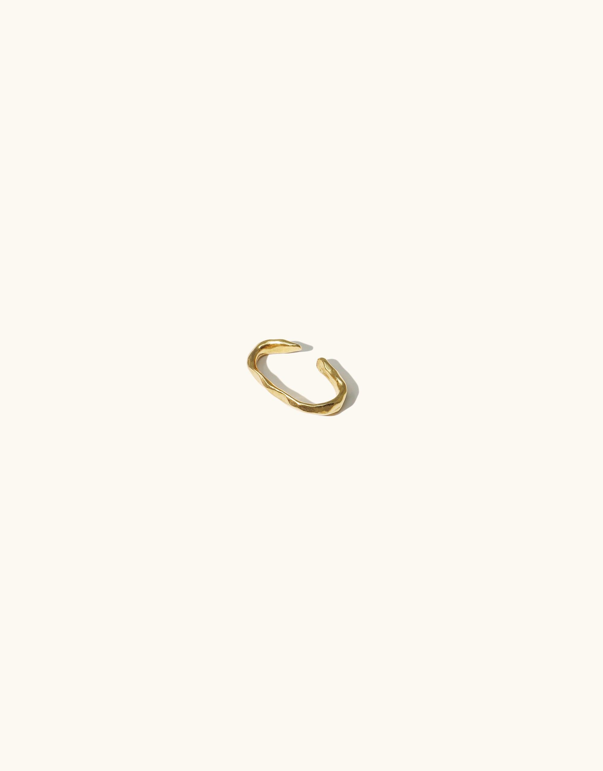 Minimalist gold ear cuff with abstract curved design inspired by canyon terrain, part of the Terrain Collection. Handcrafted in Los Angeles, available in sterling silver or gold vermeil. Rock Ear Cuff | Single by CLED