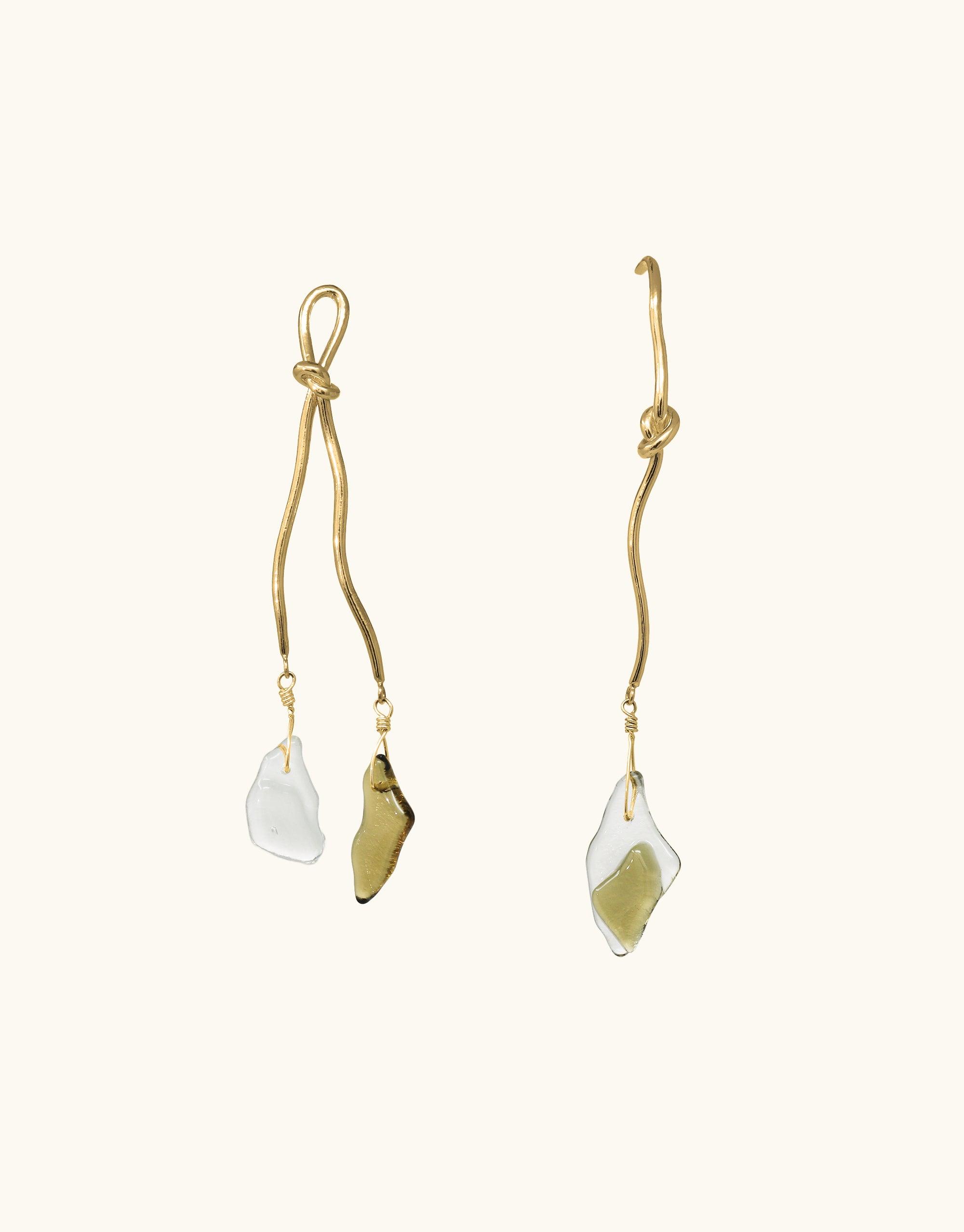 Elegant gold vermeil Rope Drop Earrings featuring unique twisted metal designs inspired by climbing ropes, adorned with eco-friendly glass drops in clear and olive tones. Handcrafted asymmetrical pair showcasing canyon-inspired terrain collection by CLED.