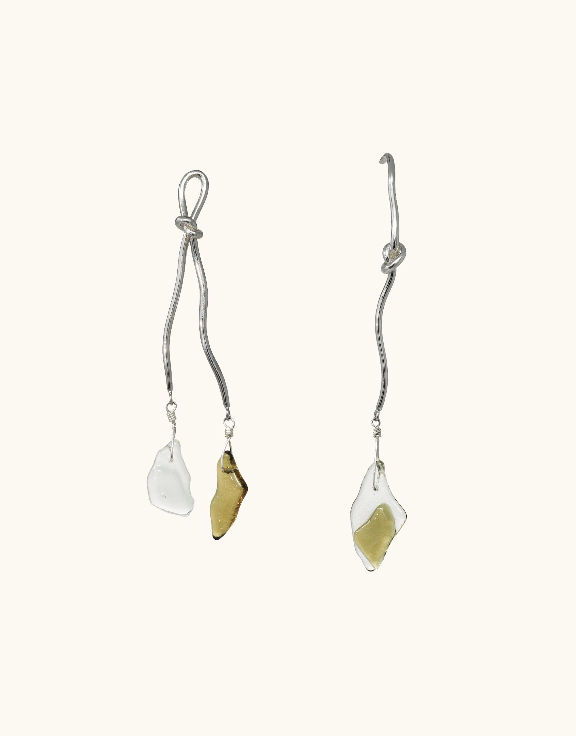 Rope Drop Earrings featuring sterling silver knotted wire and eco-friendly glass drops in clear and amber colors. Asymmetrical design inspired by canyon terrain and rock climbing tools. Handmade, sustainable jewelry by CLED.