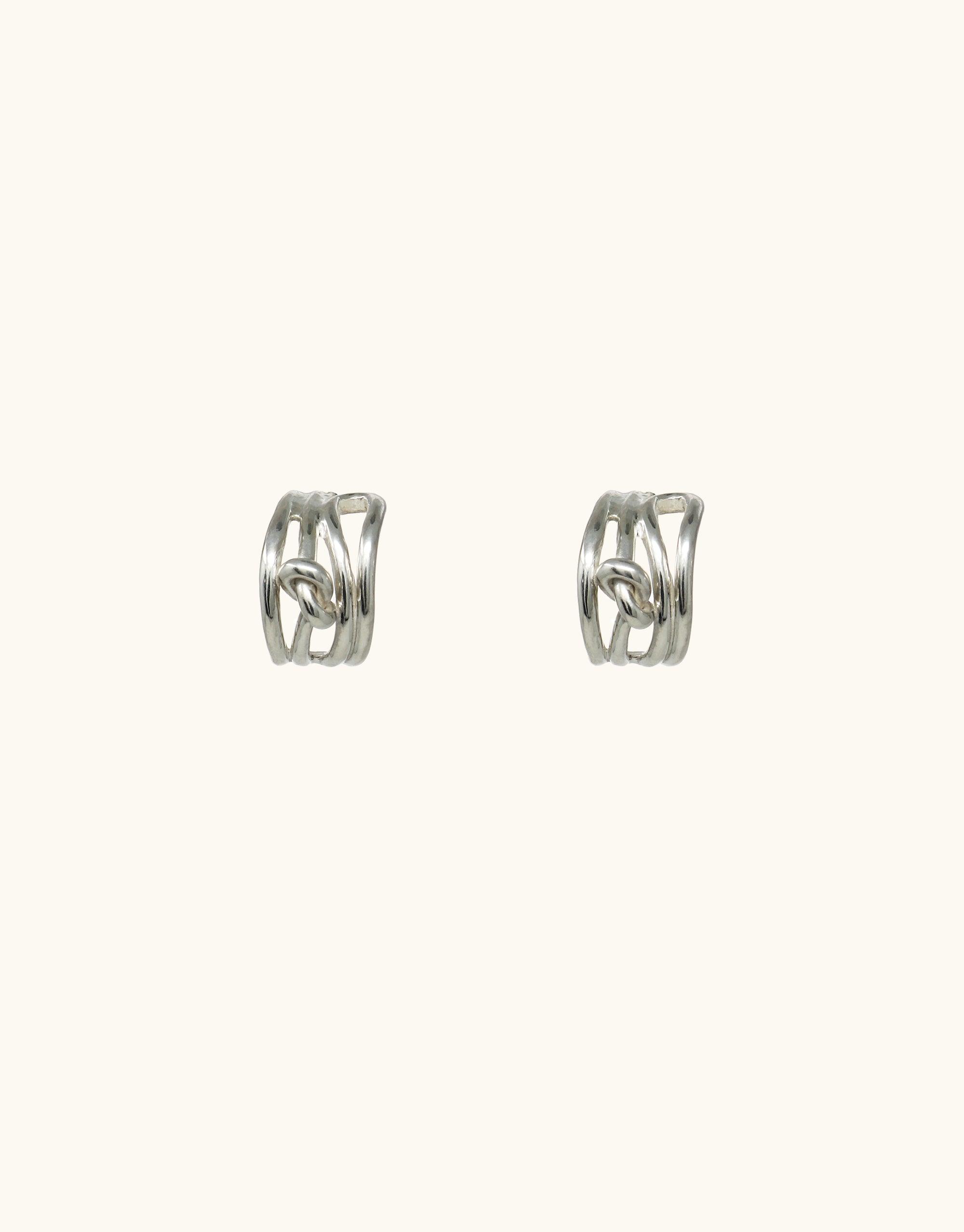 Rope Hoop Earrings featuring interwoven silver strands forming a unique, twisted design. Minimalist yet eye-catching, these earrings add a modern touch to any outfit. Handcrafted in Los Angeles, inspired by canyon terrain. Terrain Collection by CLED.