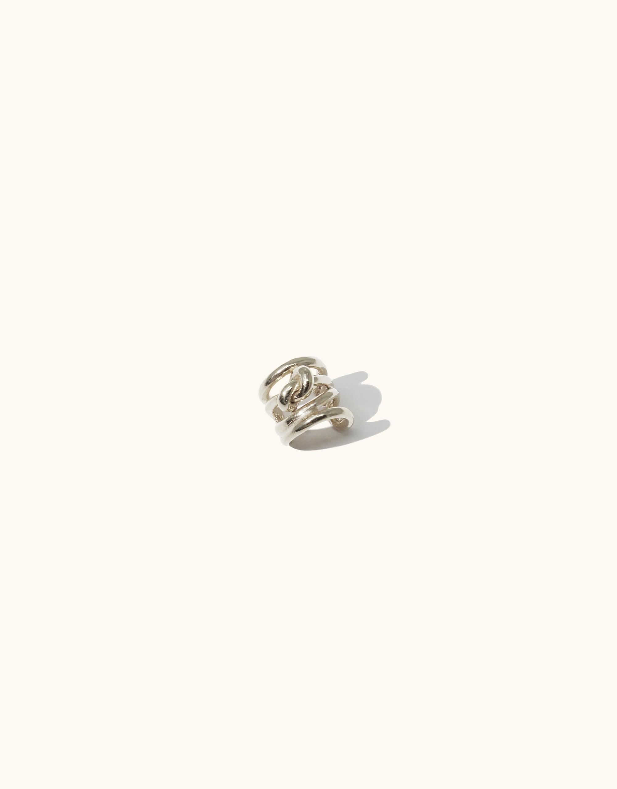 Rope Ear Cuff | Single - Elegant silver-toned metal ear cuff with intertwined rope-like design, inspired by canyon terrain. Versatile accessory for solo wear or pairing with statement earrings. Handcrafted in Los Angeles. CLED